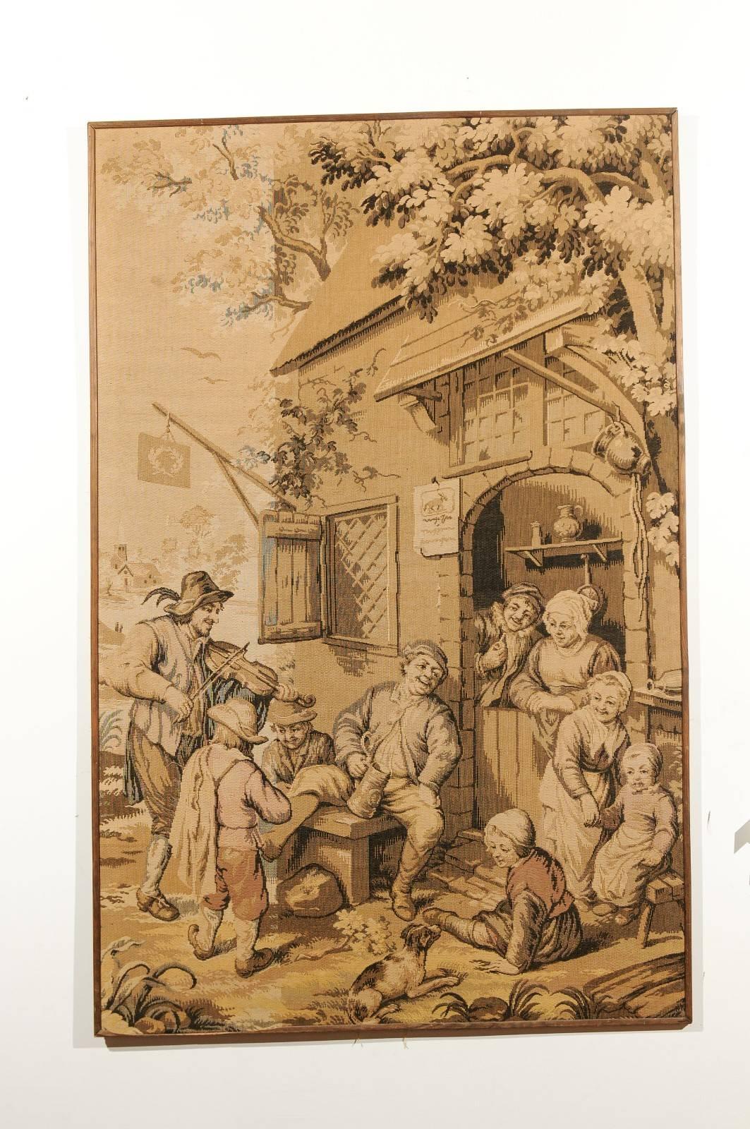 This exquisite French vertical format tapestry from the 19th century features a lively scene from a French Provincial village. We can almost hear the laughter’s from the villagers and the sound coming from the character on the left playing the