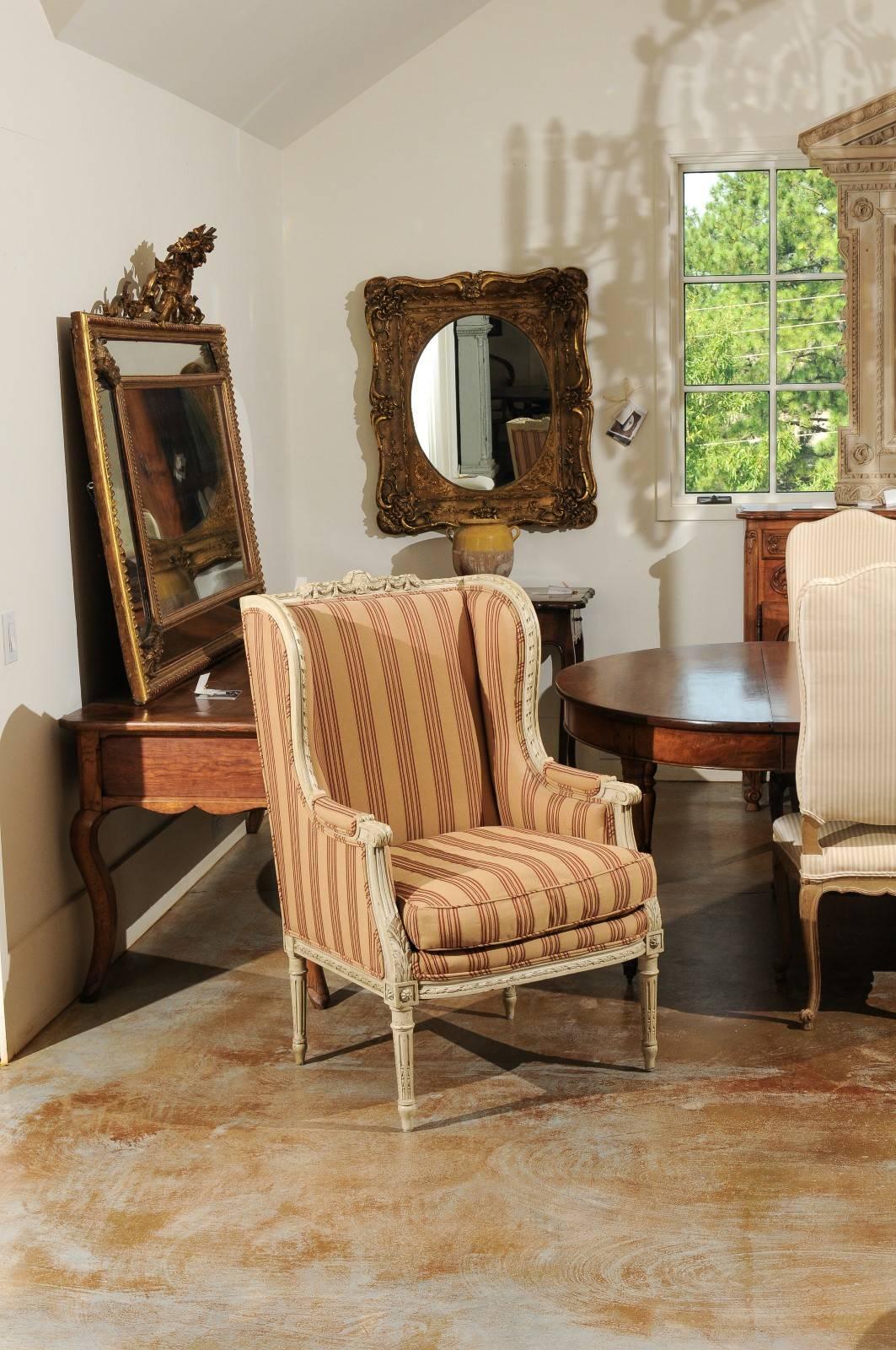 Carved French Louis XVI Style Painted Wood Upholstered Wingback Chair, circa 1880