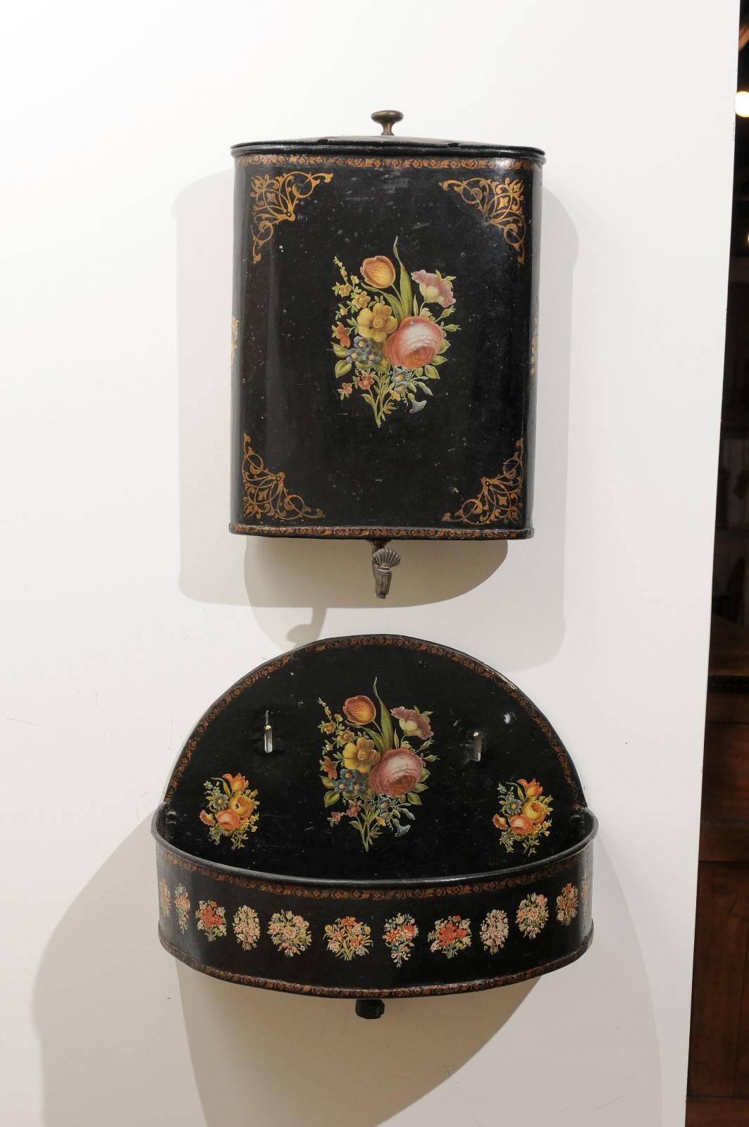 A French Napoleon III period painted tôle wall-mounted lavabo from the Ile-de-France region, second half of the 19th century. Born in the later years of the reign of Emperor Napoleon III, this French 'fontaine' features a black painted tôle body,
