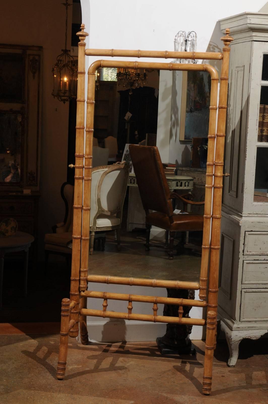 A French faux-bamboo freestanding cheval mirror from the second half of the 19th century. This French cheval mirror was born during the later years of the reign of Emperor Napoléon III, around the time when Monet was going to present his first