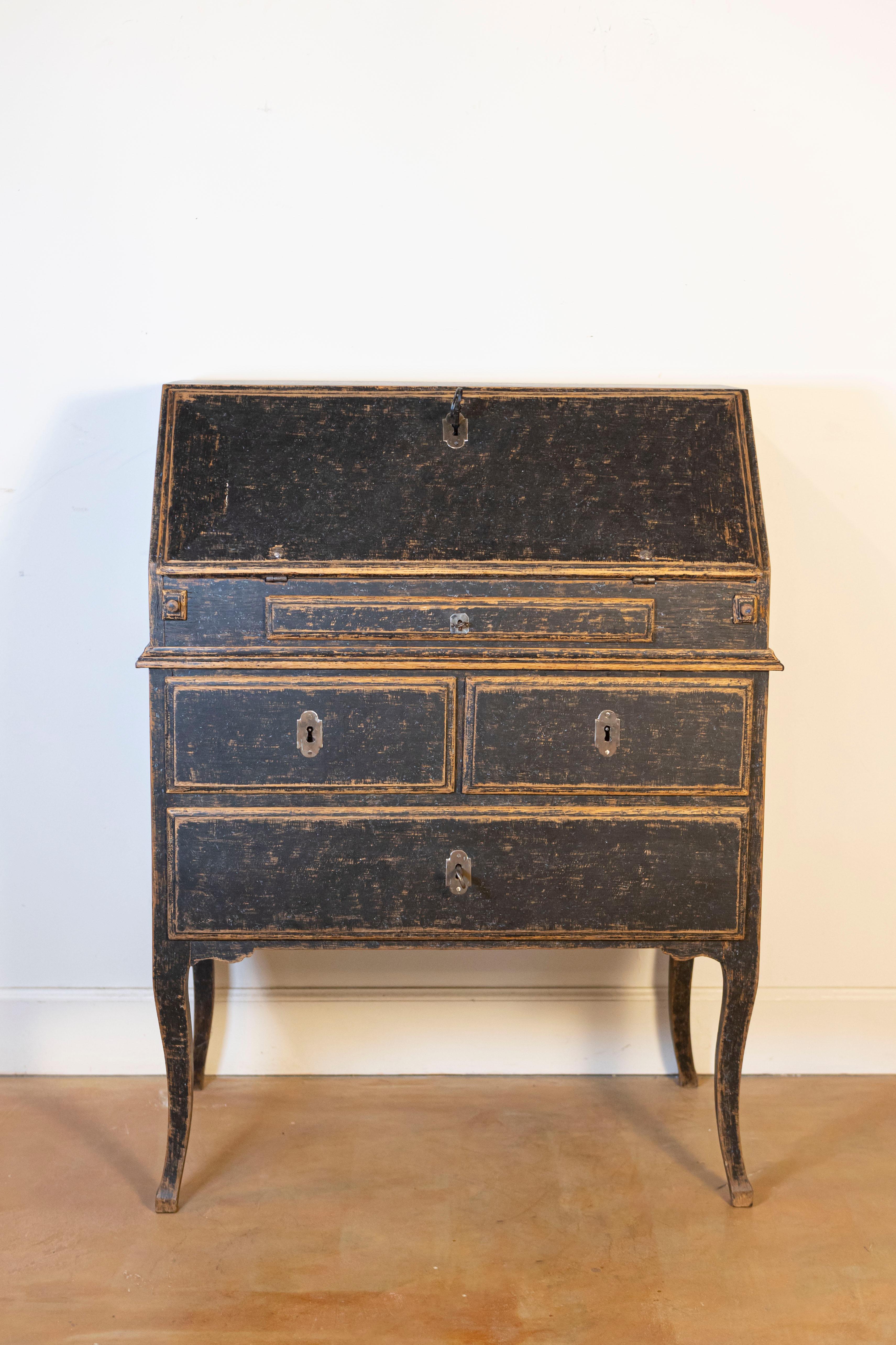 A Swedish Rococo period two-part slant-front desk from the 18th century, repainted in black with a blue interior and later iron hardware. Created in Sweden during the Rococo period, this two-part secretary features a narrow rectangular top sitting