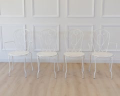 Lot de quatre chaises de jardin françaises en fer forgé du XIXe siècle