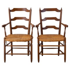 Par de sillones de roble de estilo provenzal con asientos de paja