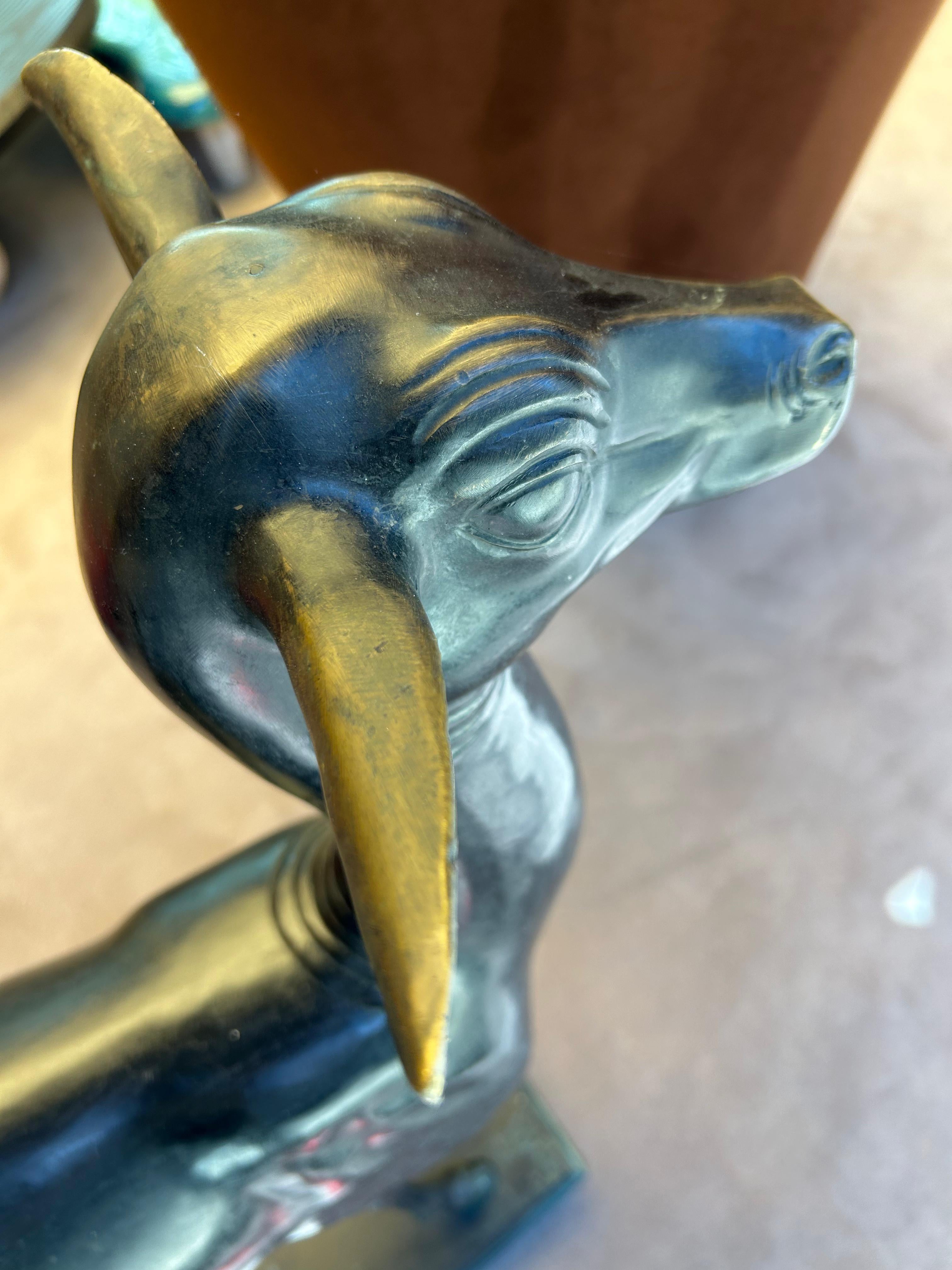 This elegant cast bronze deer statue showcases timeless craftsmanship and serene beauty. Rendered in solid bronze, the sculpture features a graceful posture and finely balanced proportions, capturing the gentle spirit and alert presence of a deer in