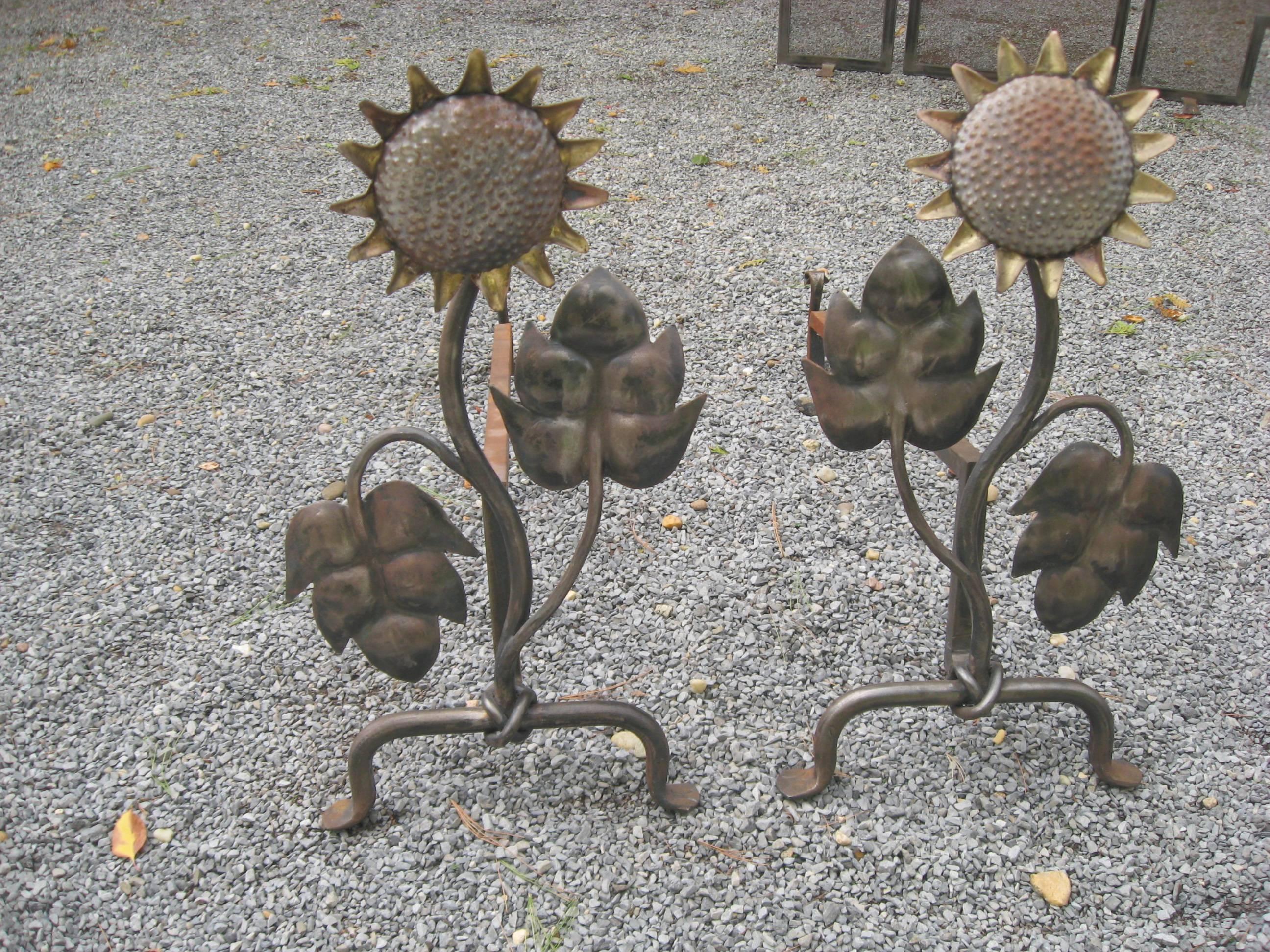 Hand-forged eight-piece iron and brass sun flower fireplace set
andirons. Tools and screen by Patrice Humbert.