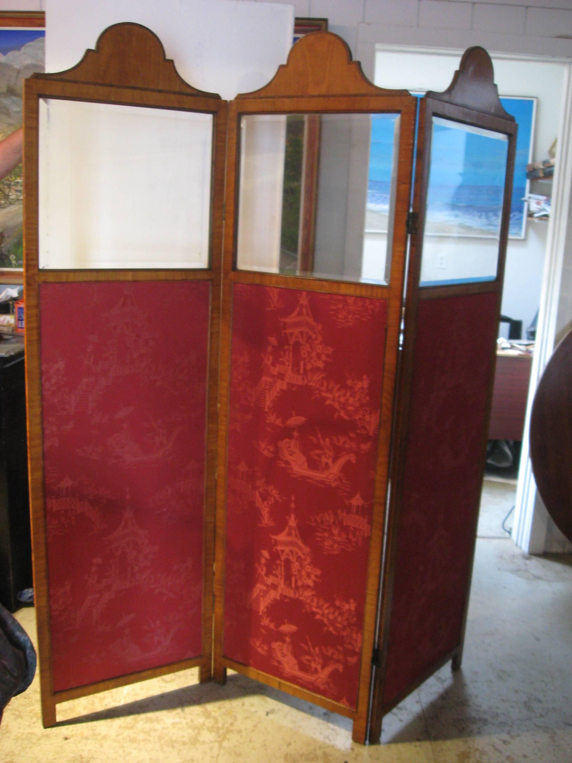 Edwardian veneered satinwood, beveled glass and oriental silk dressing screen.
