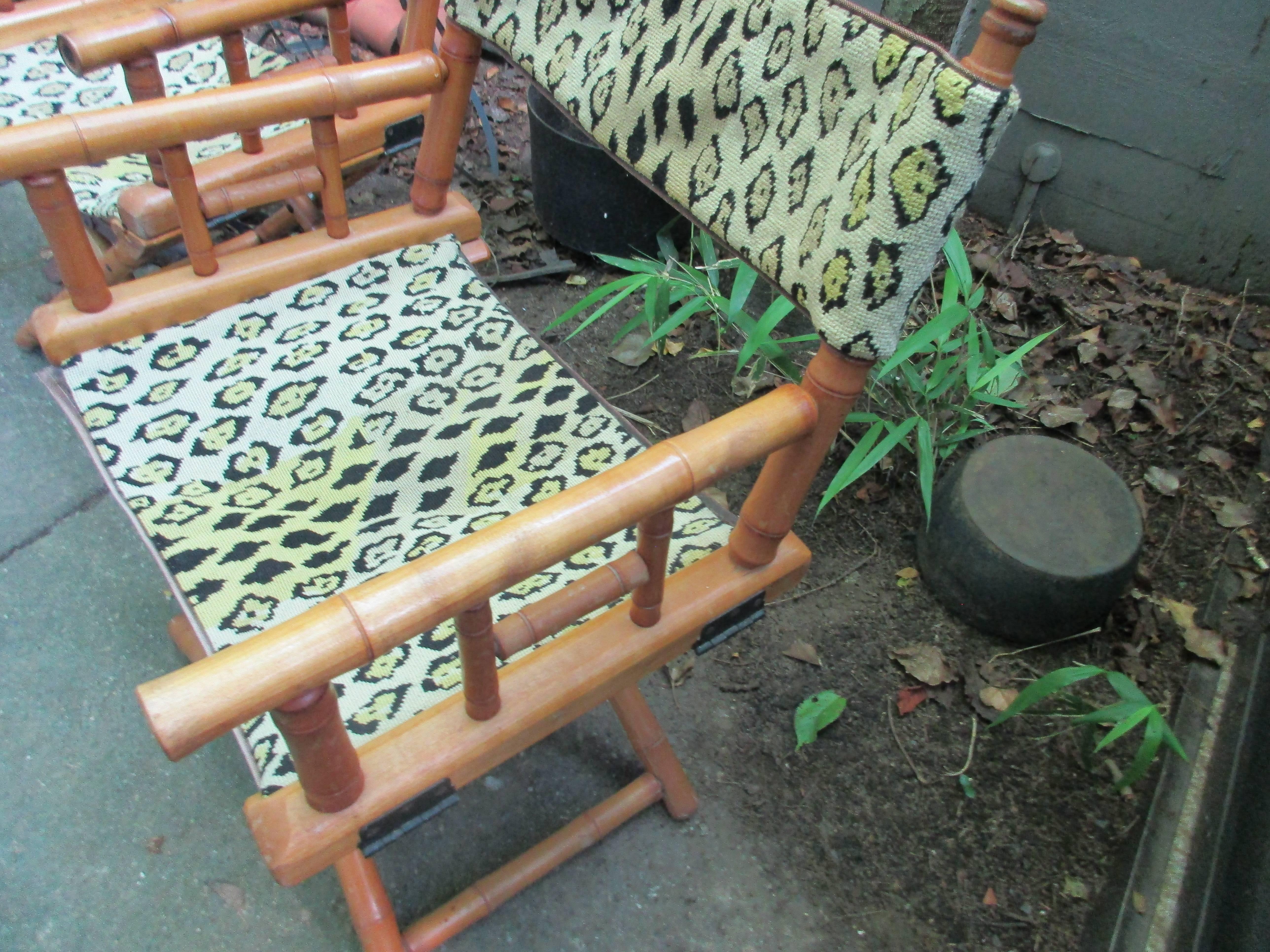 1950s faux bamboo folding chairs with handmade needlepoint seats and
backs.