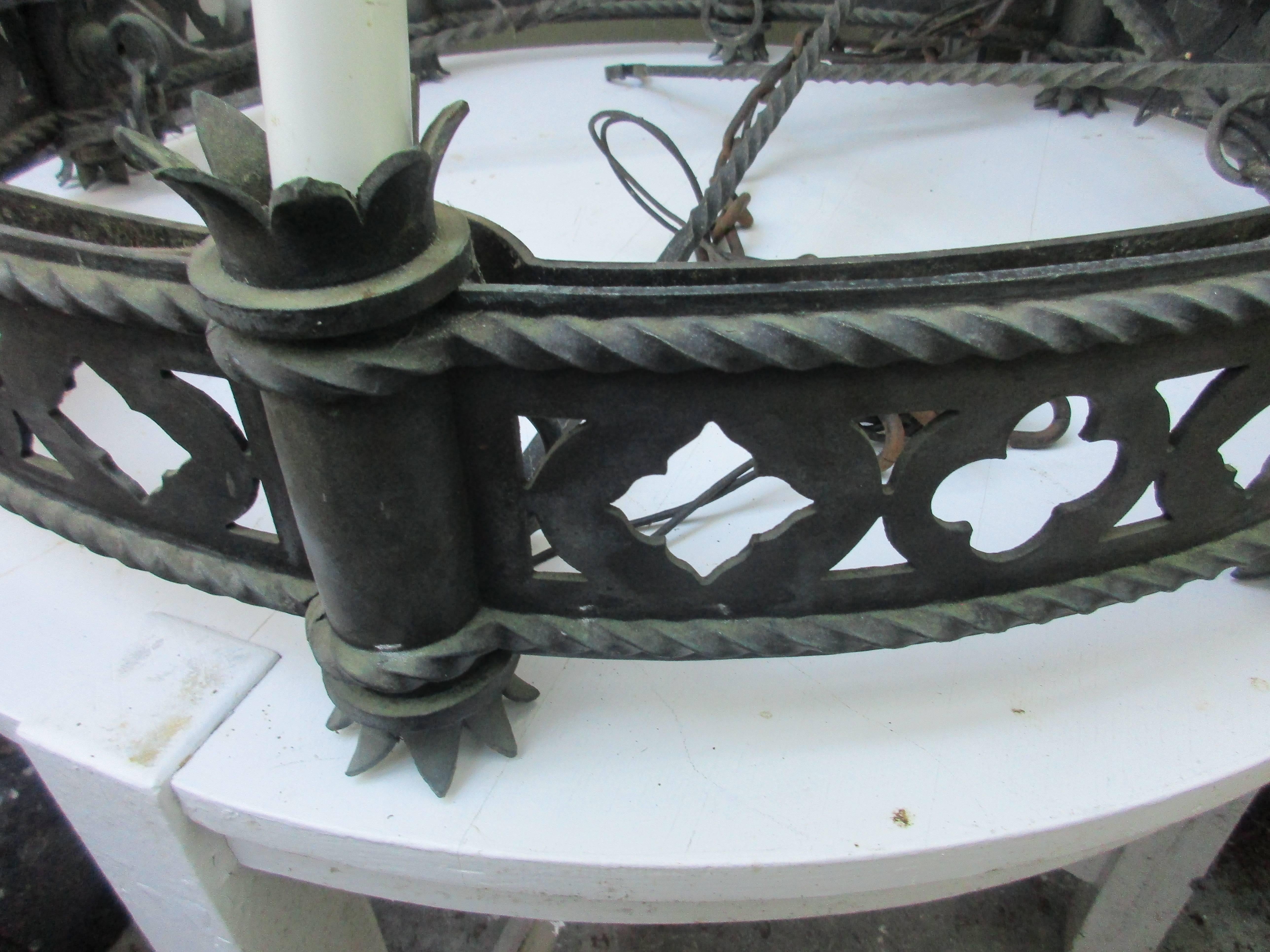 Impressive bronze Gothic chandelier with center finial that connect four bronze rods. Great age patina with.