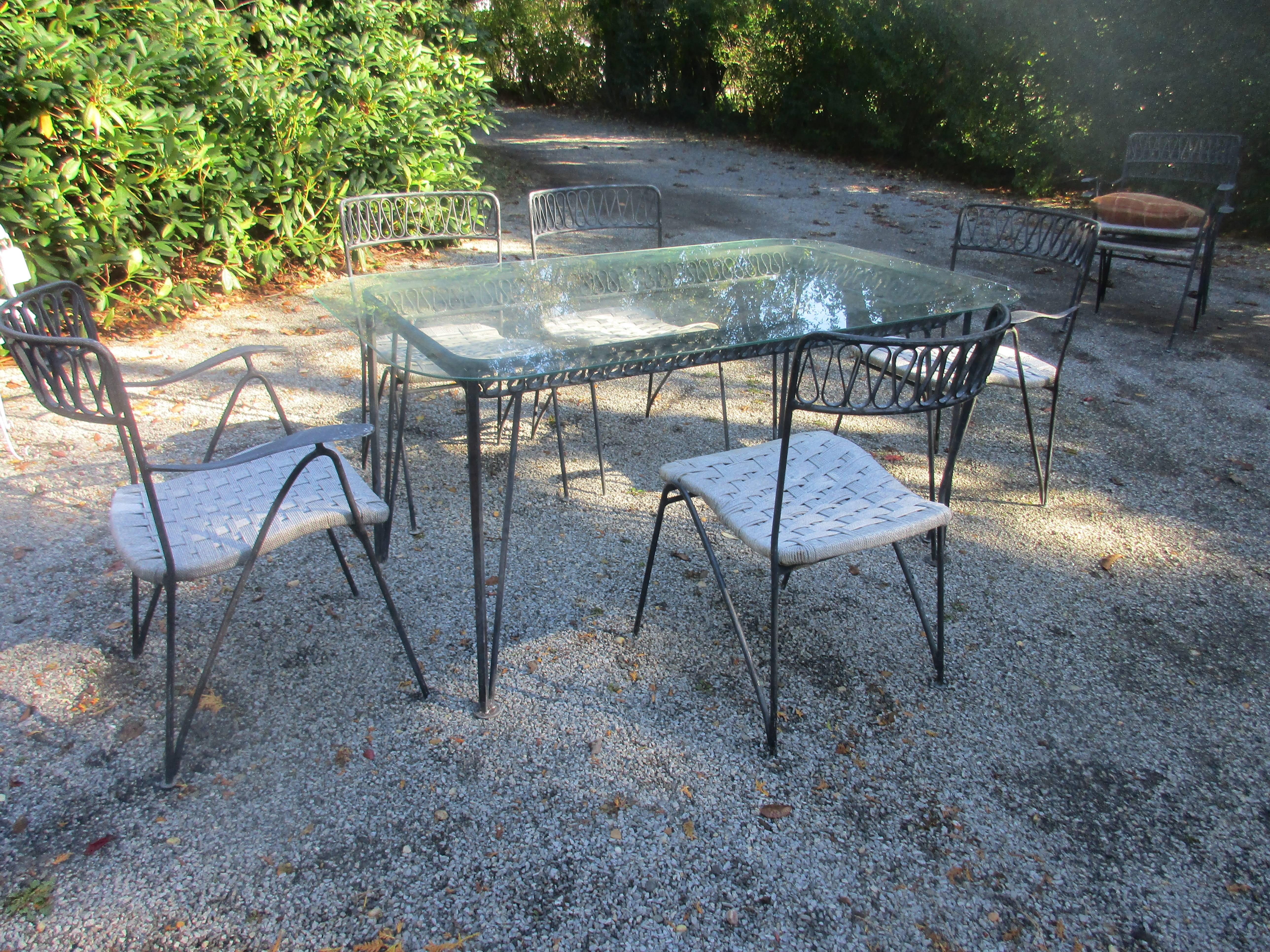 Salterini garden or patio set Glass top table with four armchairs and three side chairs.