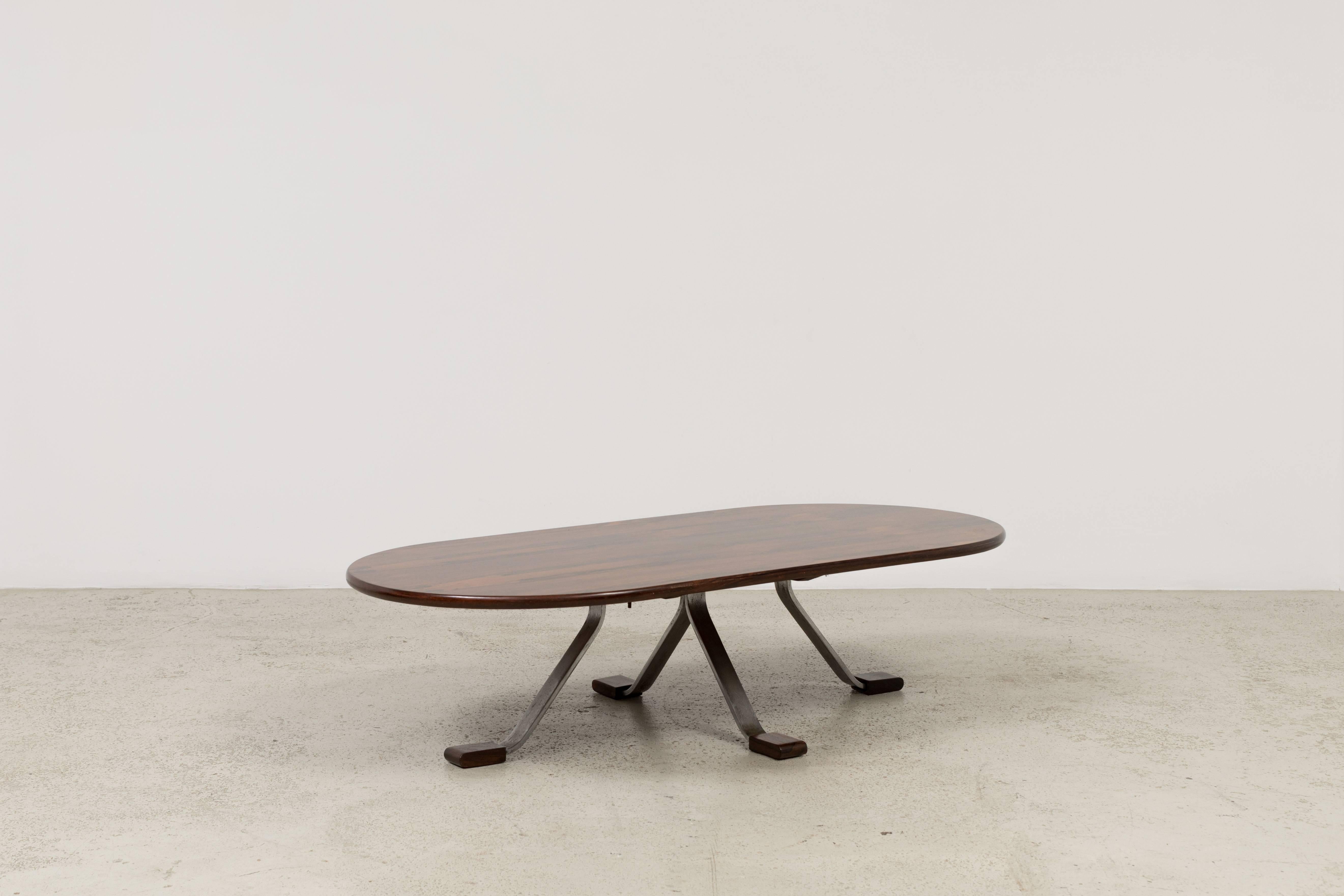 Vintage Lafer oval coffee table by Percival Lafer designed in the late 1960s. Top made of jacaranda wood and metal legs with jacaranda wood detail.
 