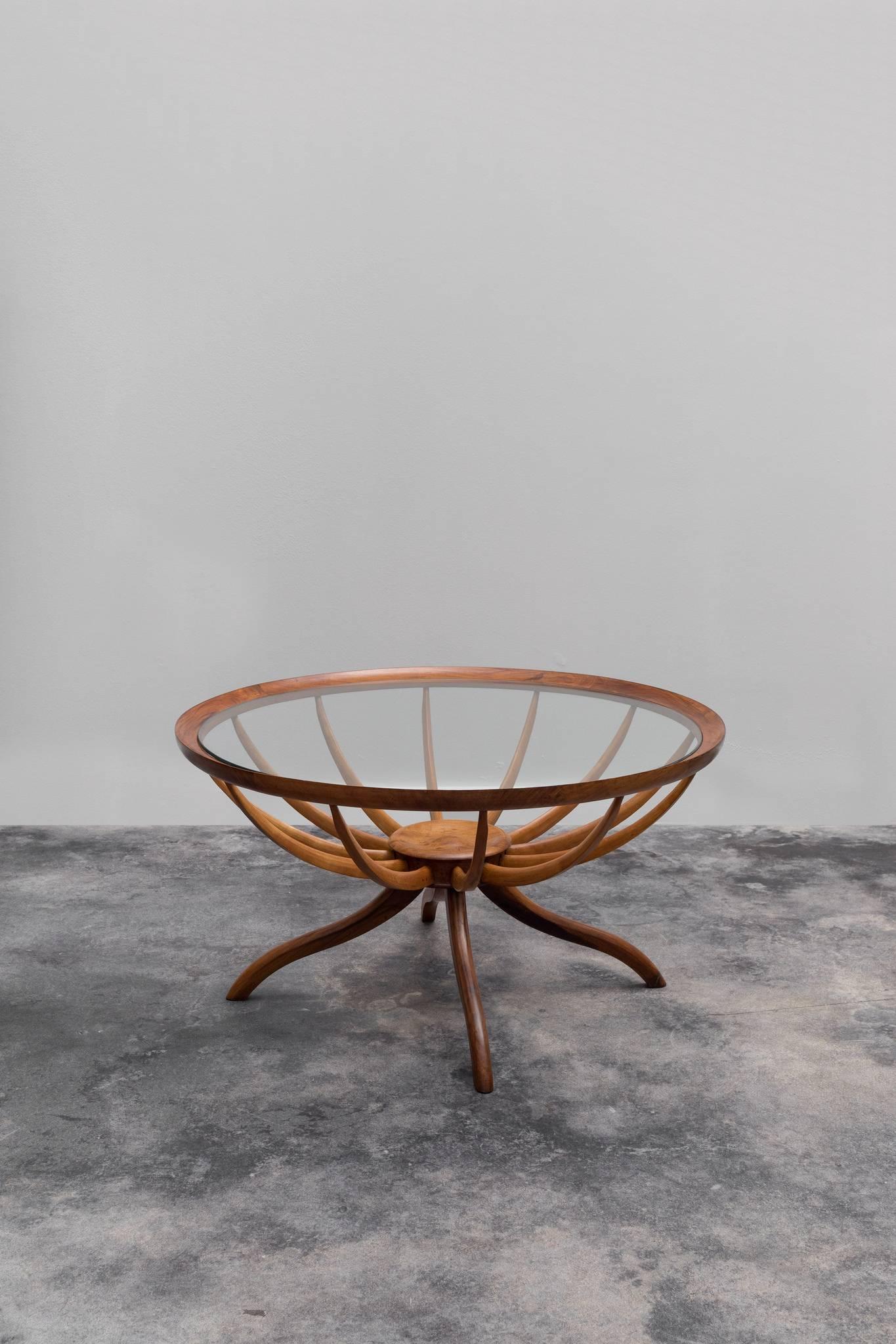 Rare Aranha coffee table designed by Giuseppe Scapinelli in the 1950s. The table has a caviuna wood structure and glass top.