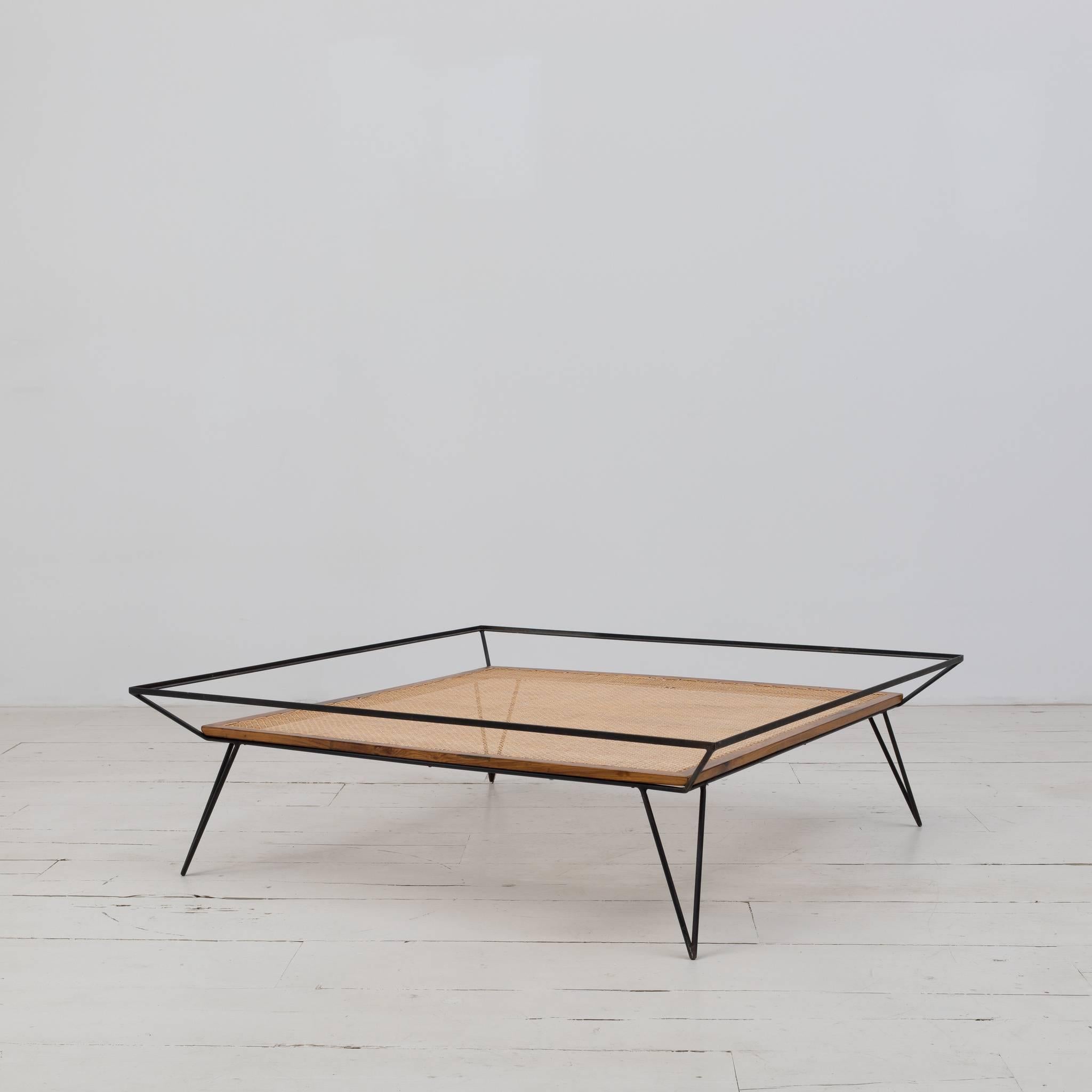 Exquisite Vintage coffee table designed by Martin Eisler and Carlo Hauner in the 1950s. Iron base structure, solid Caviuna wood, and natural cane. 

Size: W 47