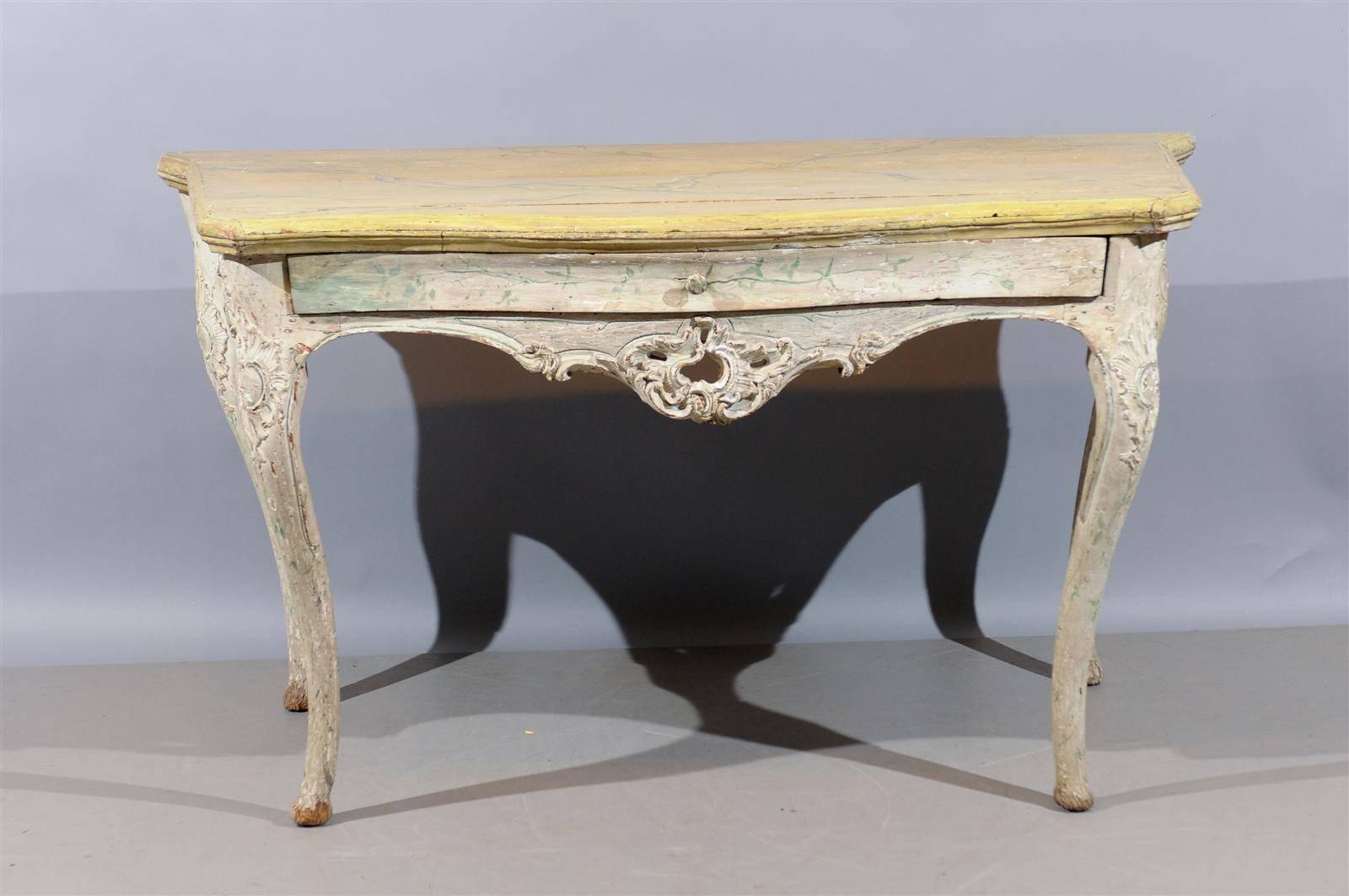 Large 18th century Italian Rococo painted console with serpentine shape and drawer.