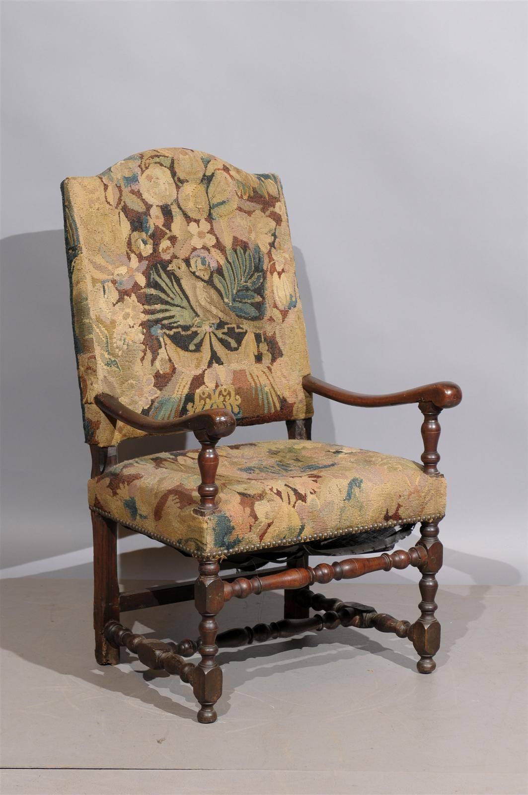 18th century French Louis XIII style walnut fauteuil in tapestry upholstery.

  