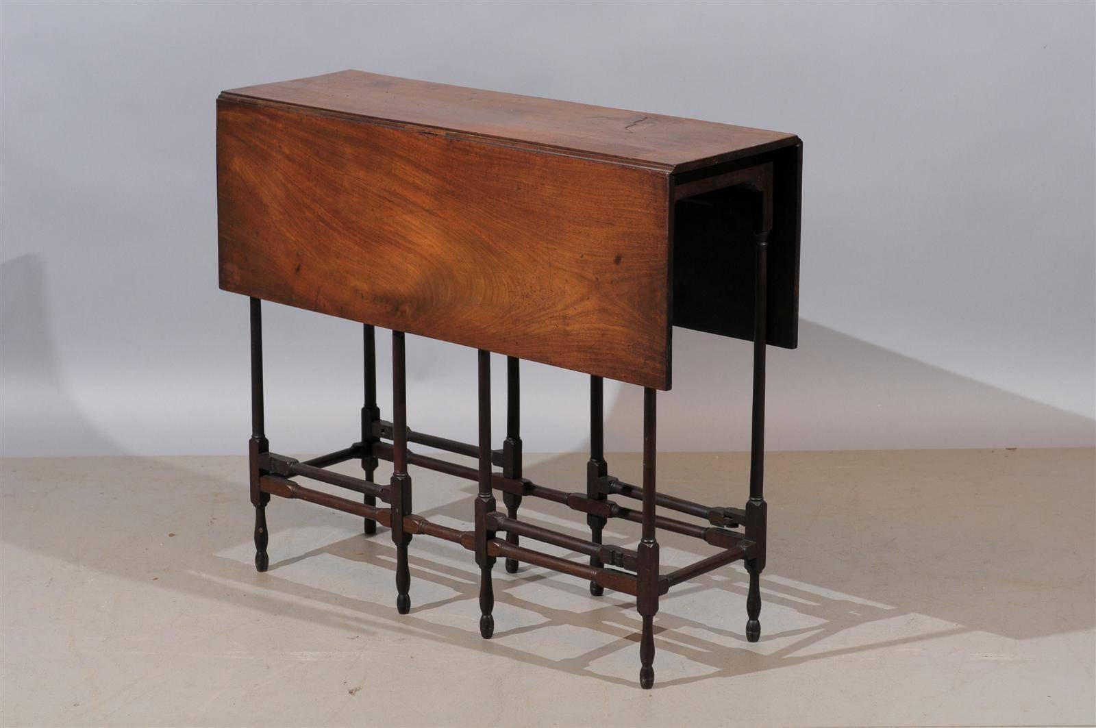 A 19th century English mahogany spider leg drop-leaf table. 

The dimensions closed is 11.75