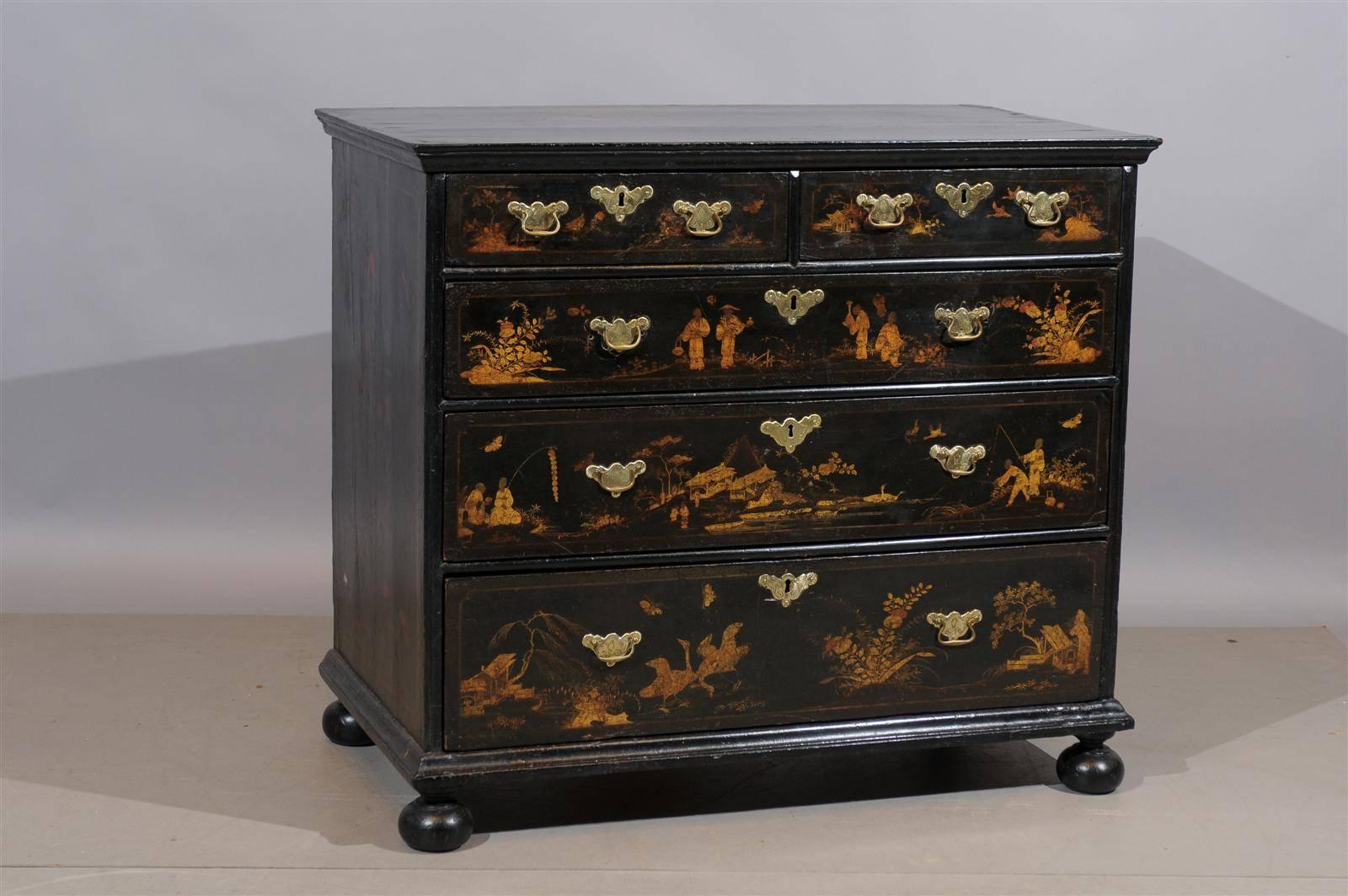 18th century English chinoiserie lacquered chest with bun feet, five drawers and brass bailpulls.