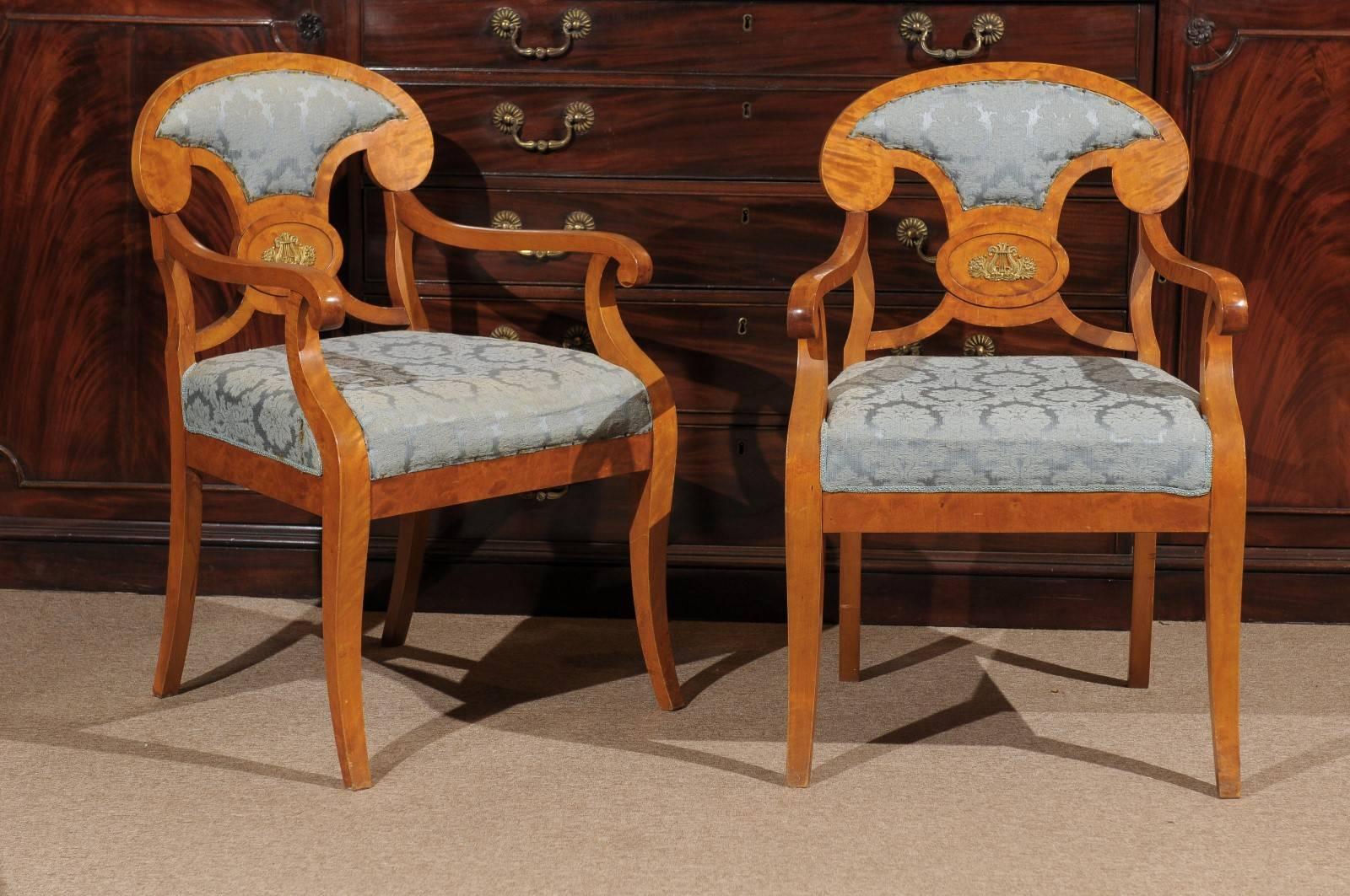 Pair of Biedermeier Style armchairs in maple, first quarter of 20th century.