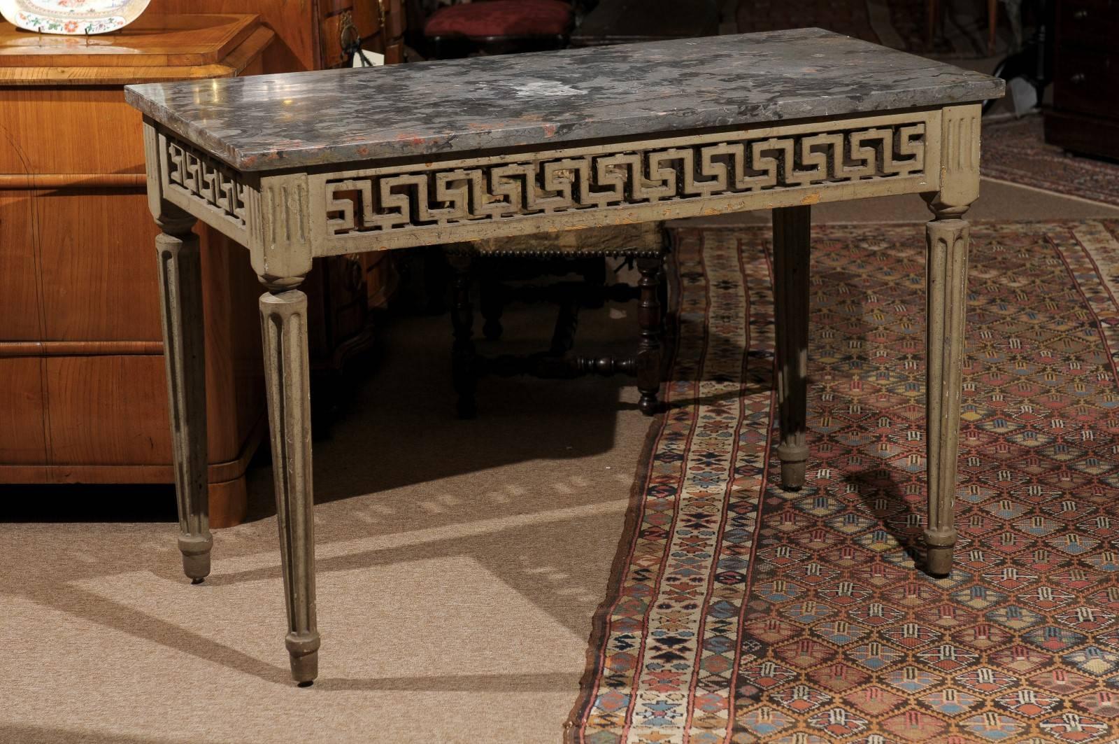 Late 18th century Louis XVI painted console with pierced Greek key frieze and grey marble top.