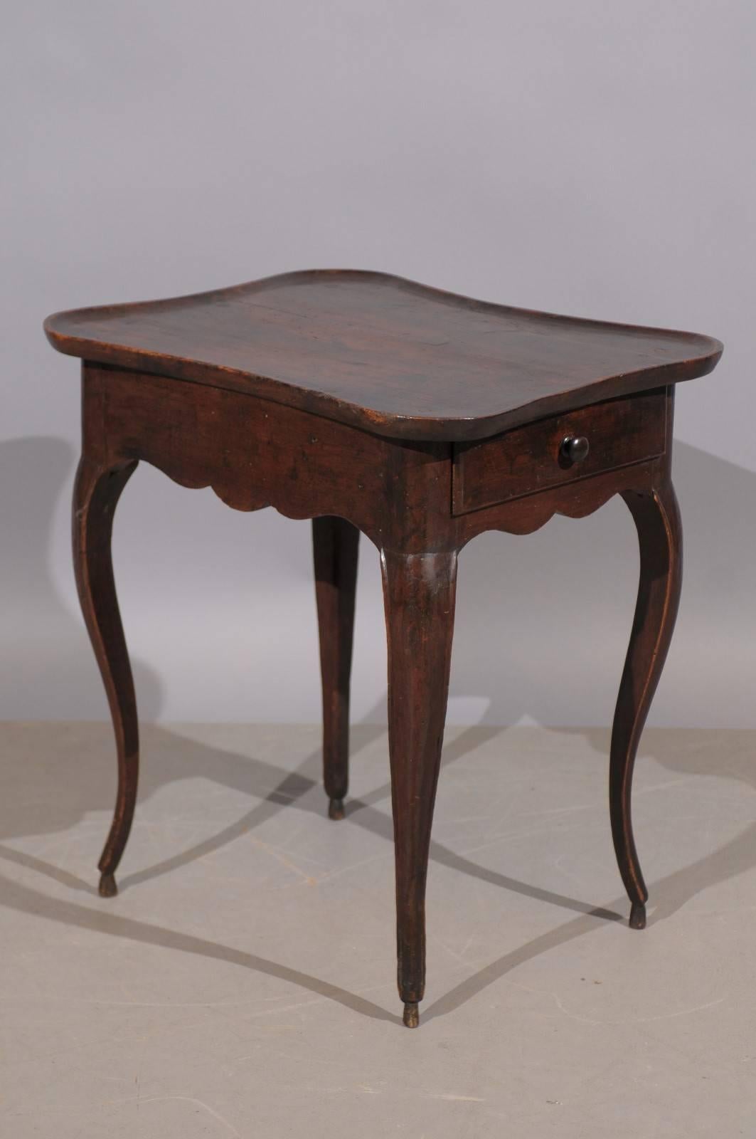 18th century French walnut table with shaped dish top and drawer.
