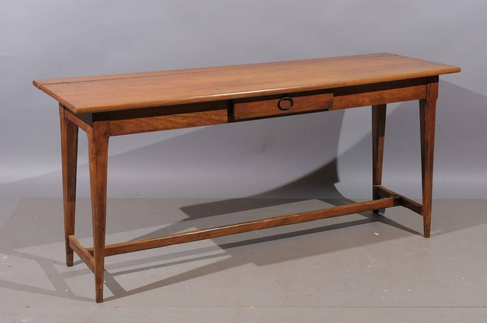 A French fruitwood server/console with drawer and tapering legs.