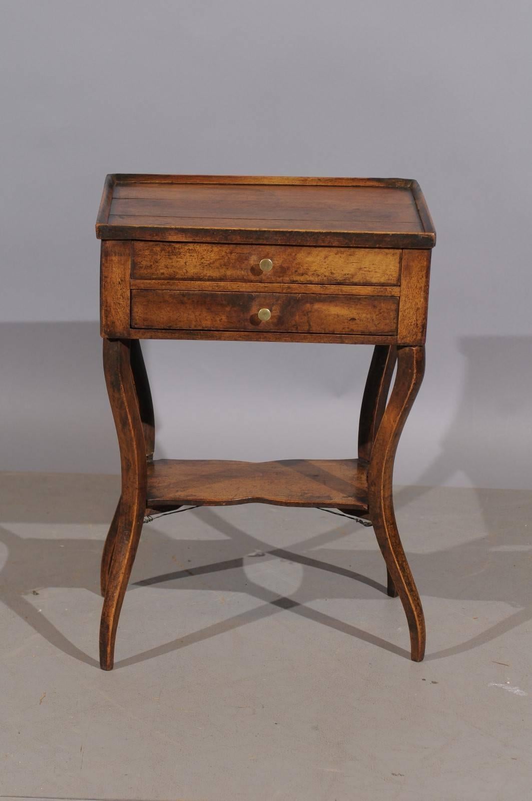 19th Century French Walnut Table with Lower Shelf and Saber Legs 1