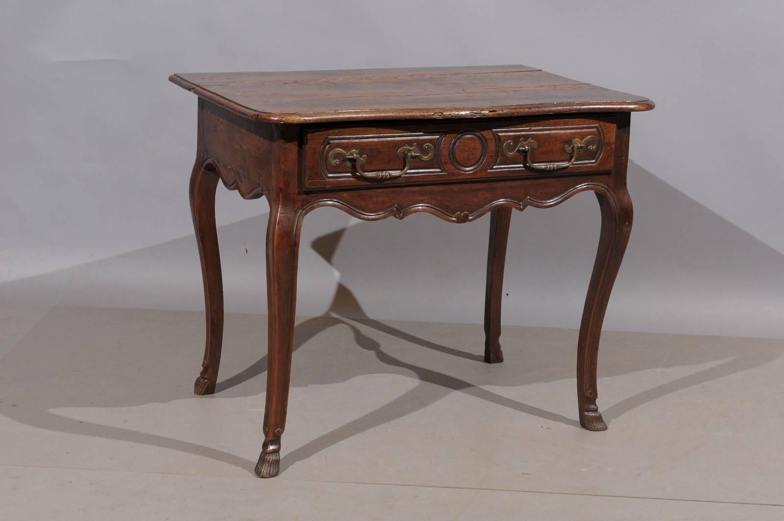 18th century French Louis XV walnut side table with drawer and hoof feet.