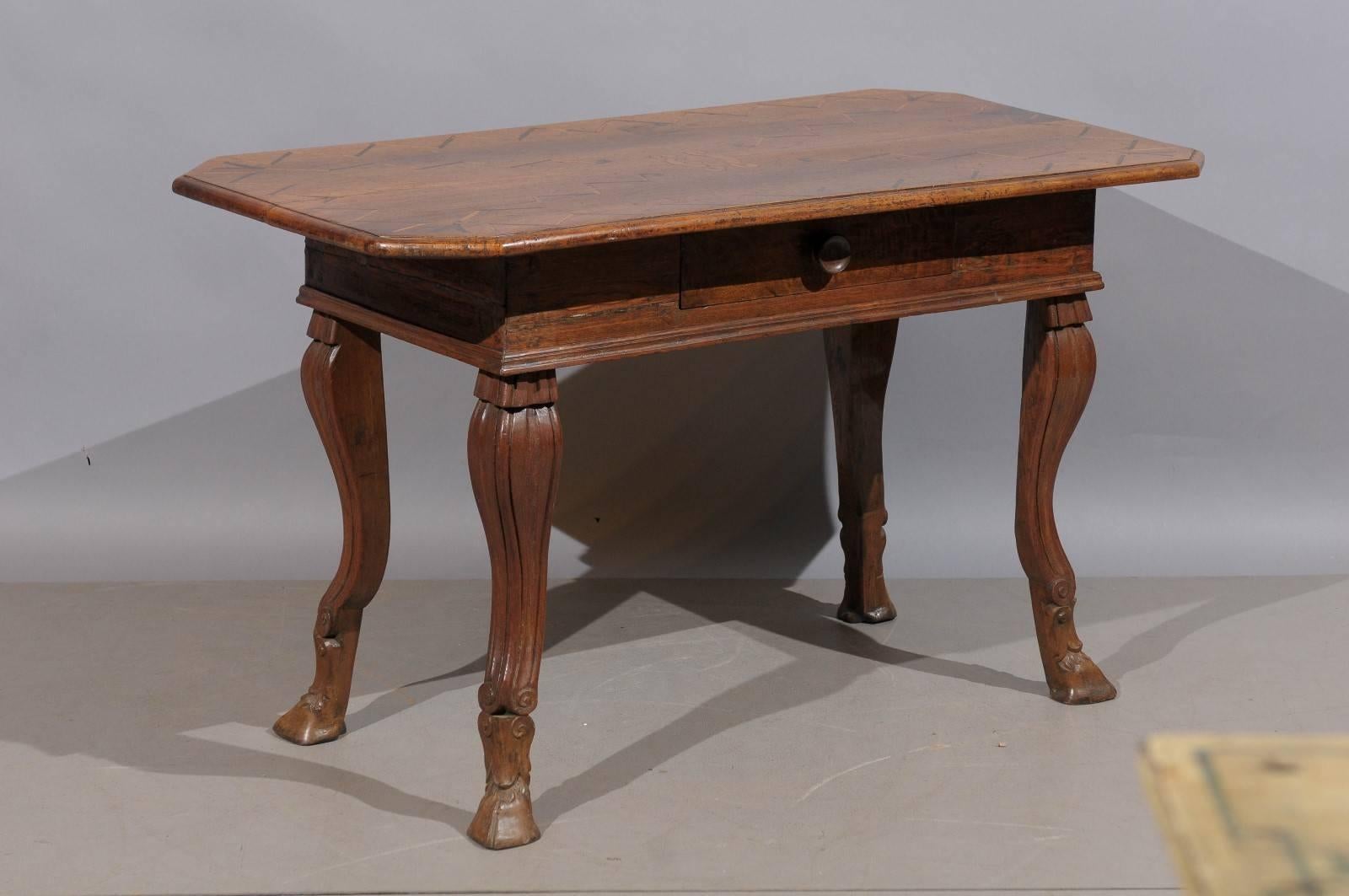 18th century Italian Rococo inlaid walnut writing table with hoofed feet.