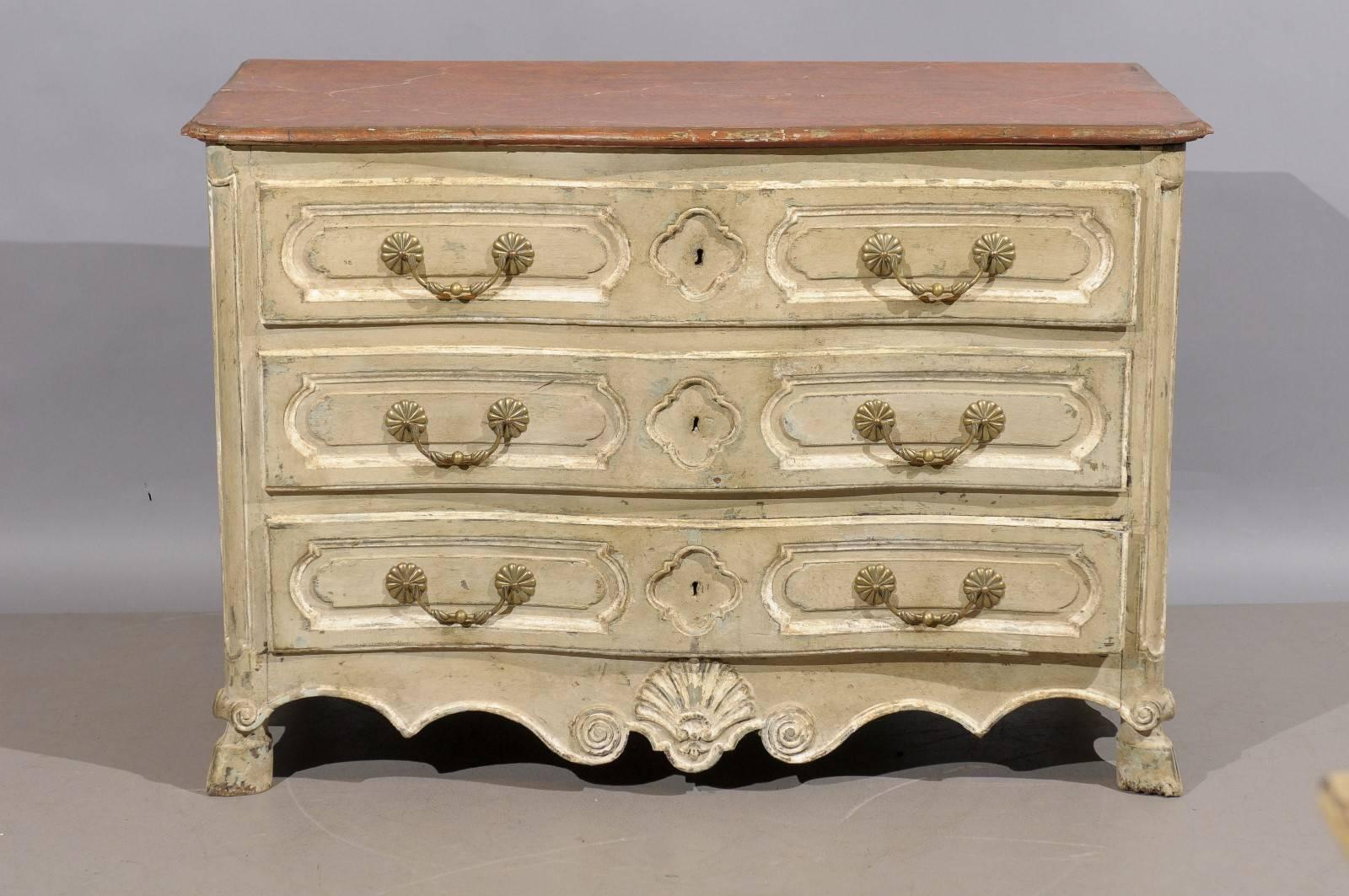 Large 18th century French Louis XV, Regence period three-drawer commode with hoof feet and faux marble top.