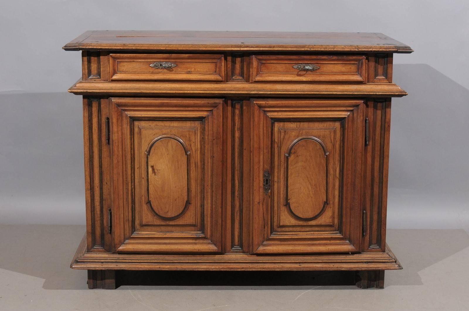 Louis XIV walnut buffet with two drawers and doors, France, 18th century.