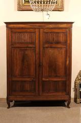 Early 19th Century Italian Walnut Armoire with Carvel Panel Doors & Cabriole Leg