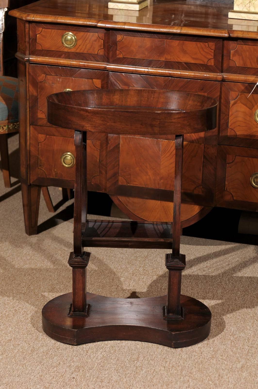 Empire style side table in mahogany with oval shaped dish top and lyre base with brass "Strings", France, circa 1890. Medium mahogany finish. Excellent antique condition.