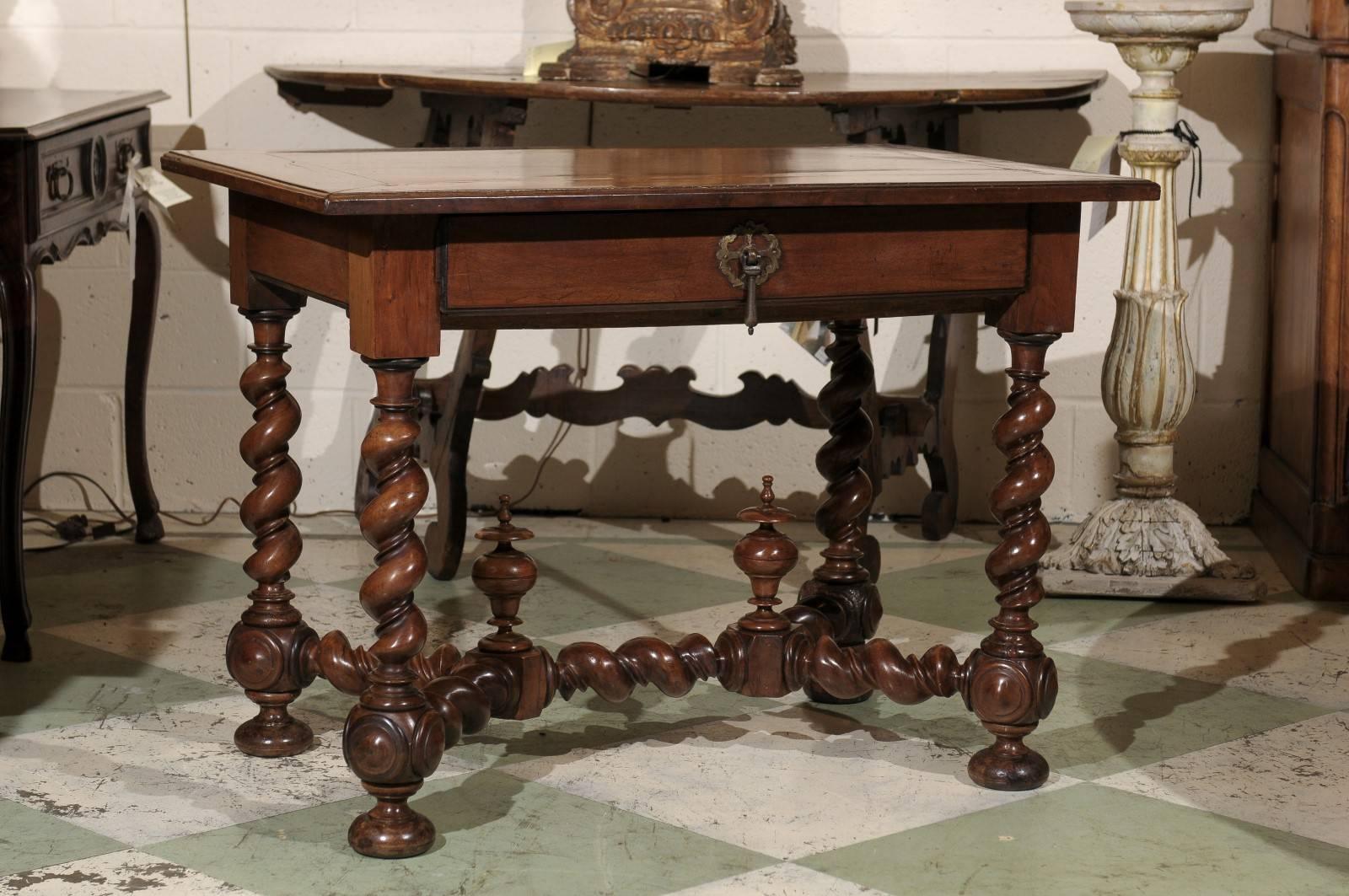 18th century walnut table with barley twist legs and stretcher and one drawer.