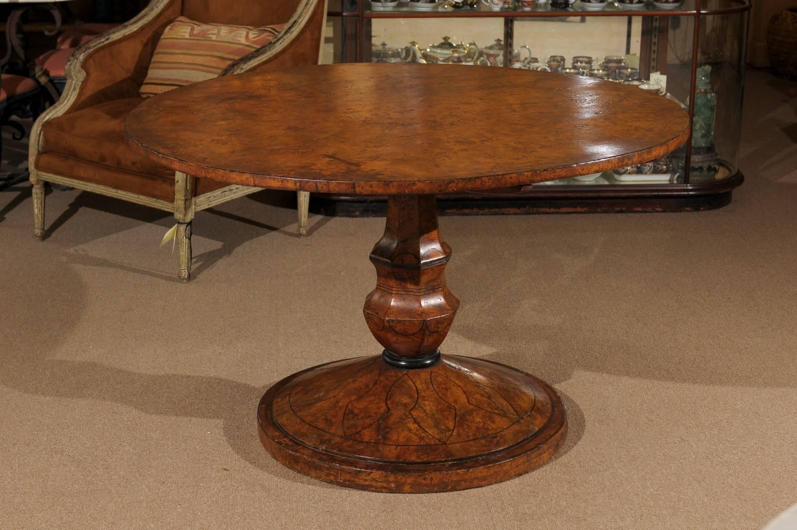 Biedermeier burled elm centre table on pedestal base with ebonized string inlay, 19th century continental.