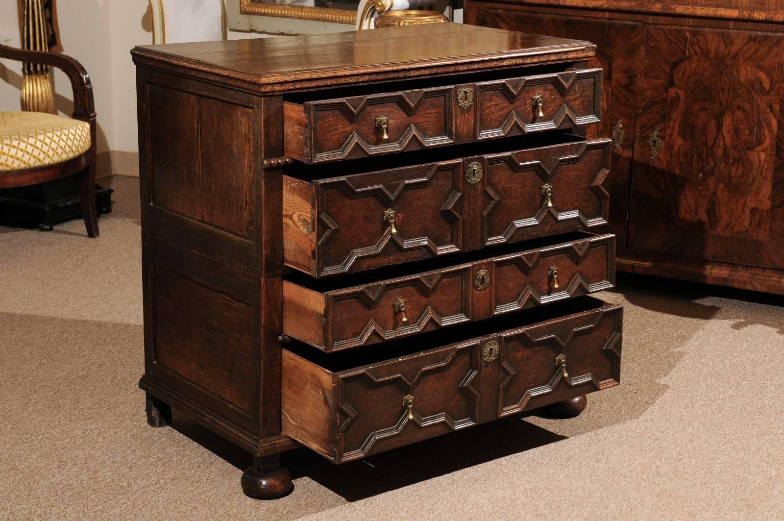 18th Century and Earlier 18th Century English Jacobean Style Oak Chest with Four Drawers and Bun Feet