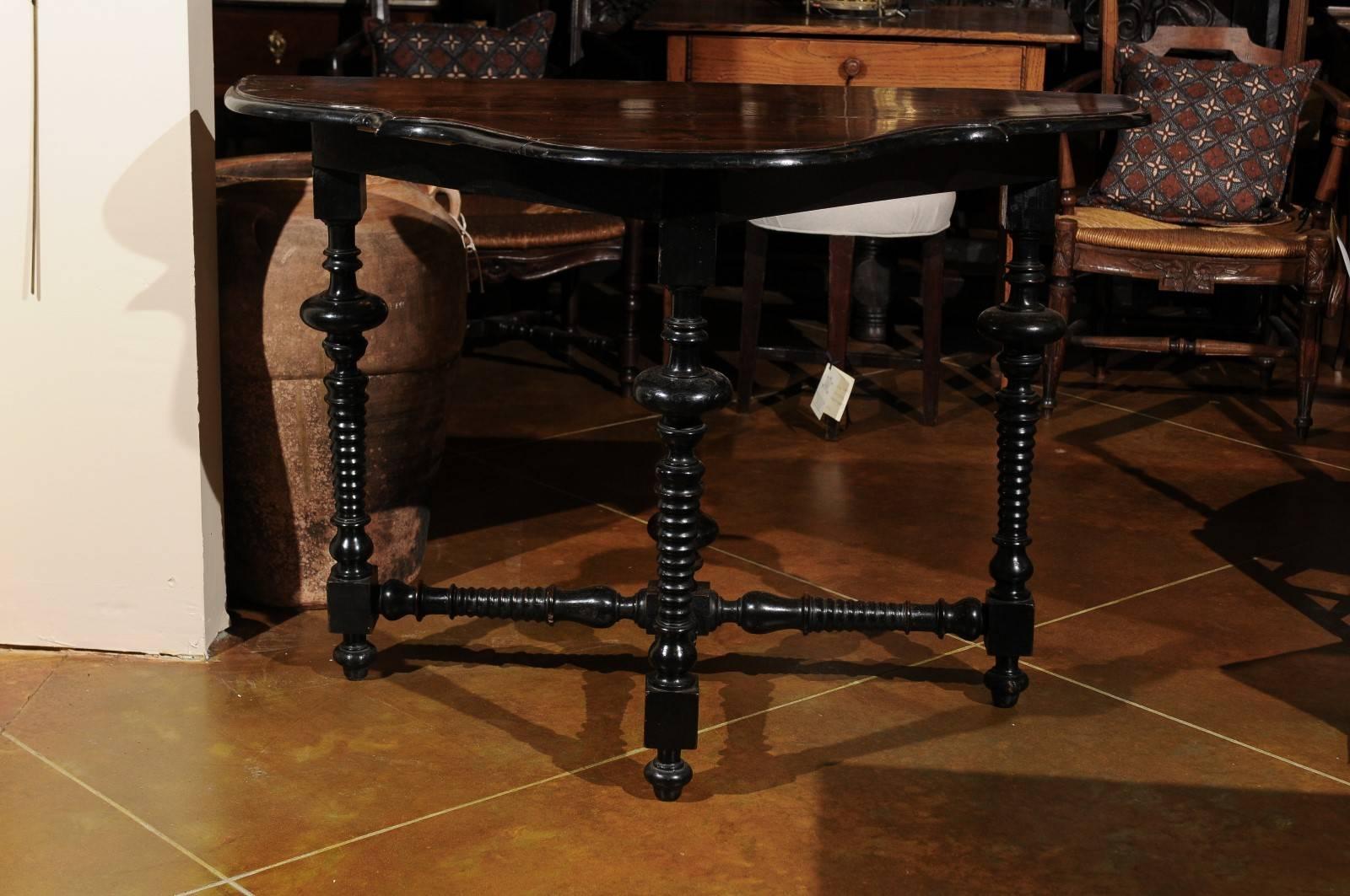 Italian 18th century console table in the Louis XIII style with serpentine form, walnut top and ebonized turned legs and stretcher.