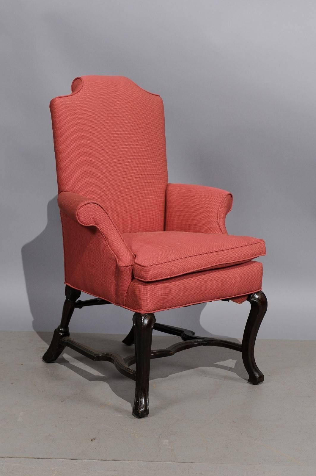 William & Mary style walnut upholstered armchair with cabriole front legs, splayed back legs and H-form stretcher.