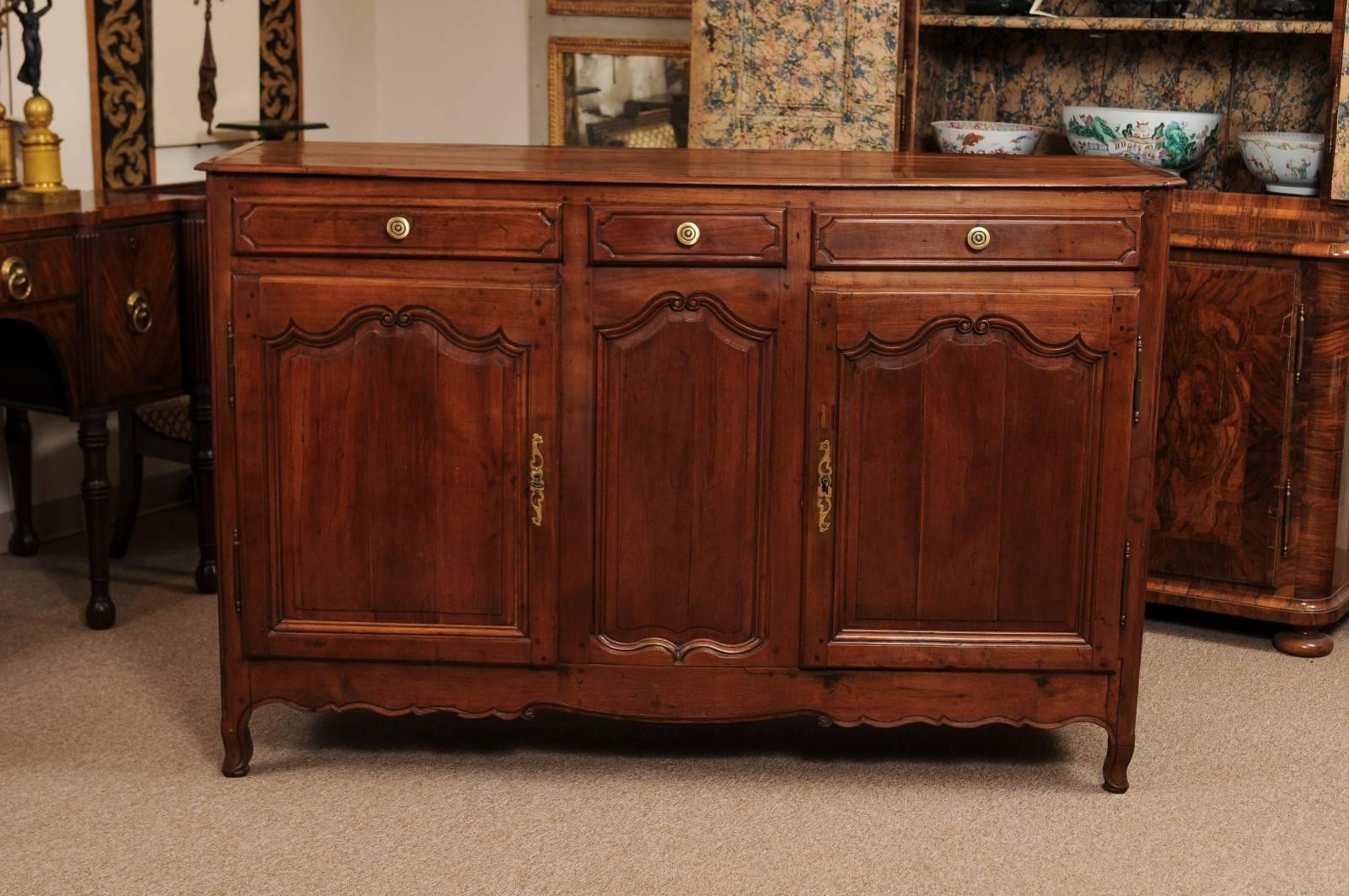 Louis XV Style Fruitwood Enfilade on Cabriole Feet with Three (3) Drawers above Two (2) Cabinet Doors and Shaped Apron. France circa 1820