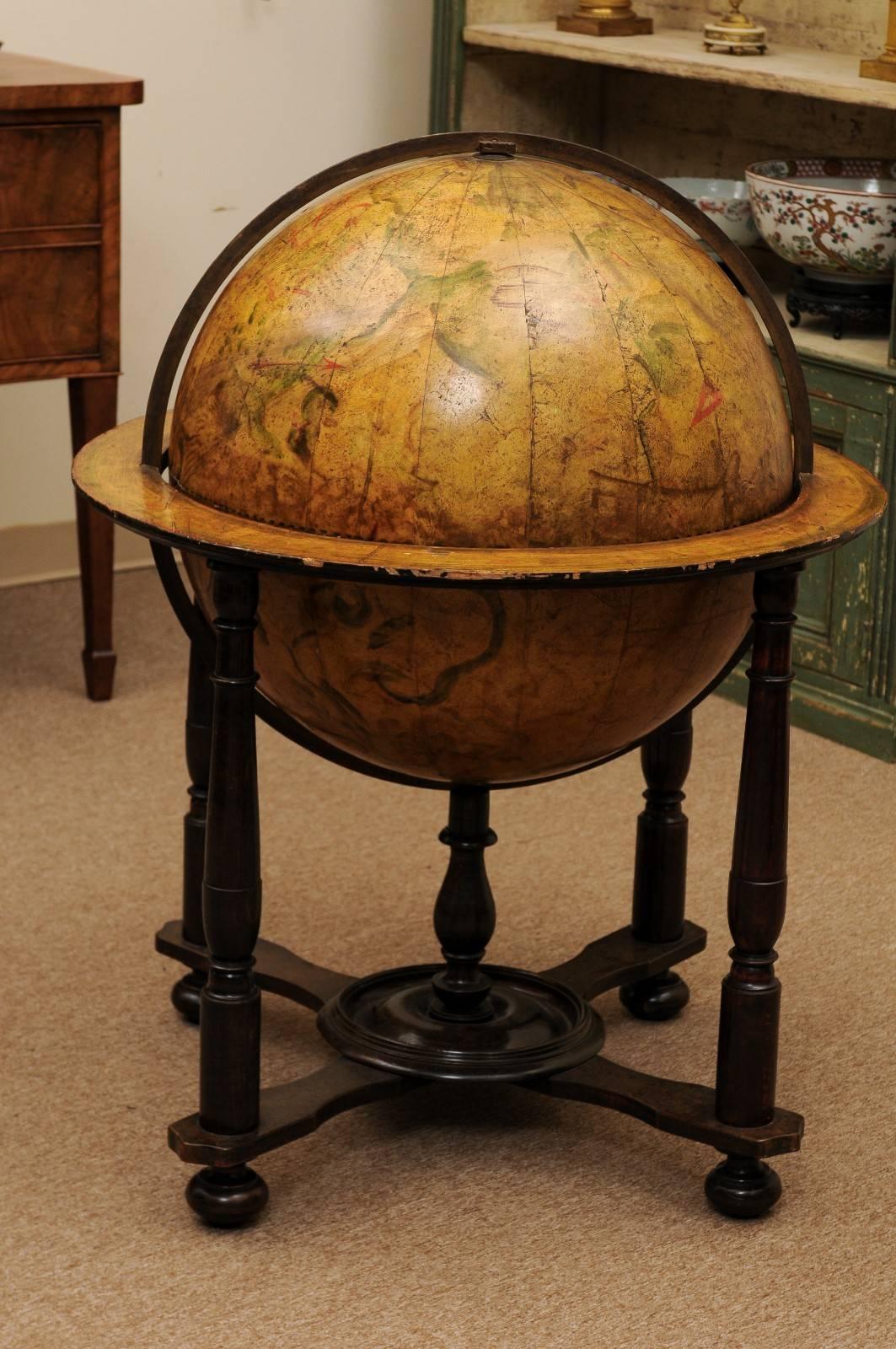 17th century Italian painted celestial globe mounted in custom wooden Stand with turned legs and bun feet (later, 19th century).