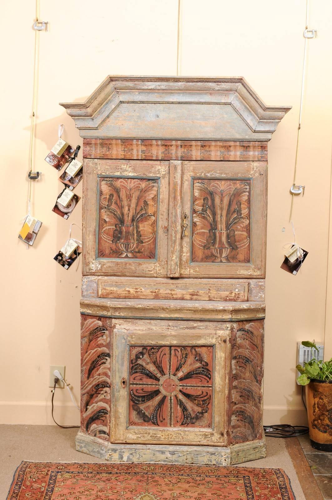 Early 19th century Swedish painted polychrome cupboard with ochre hue accents and arched cornice.

 