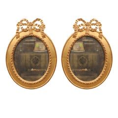 Pair of Giltwood Oval Bow-Topped Mirrors, 20th Century
