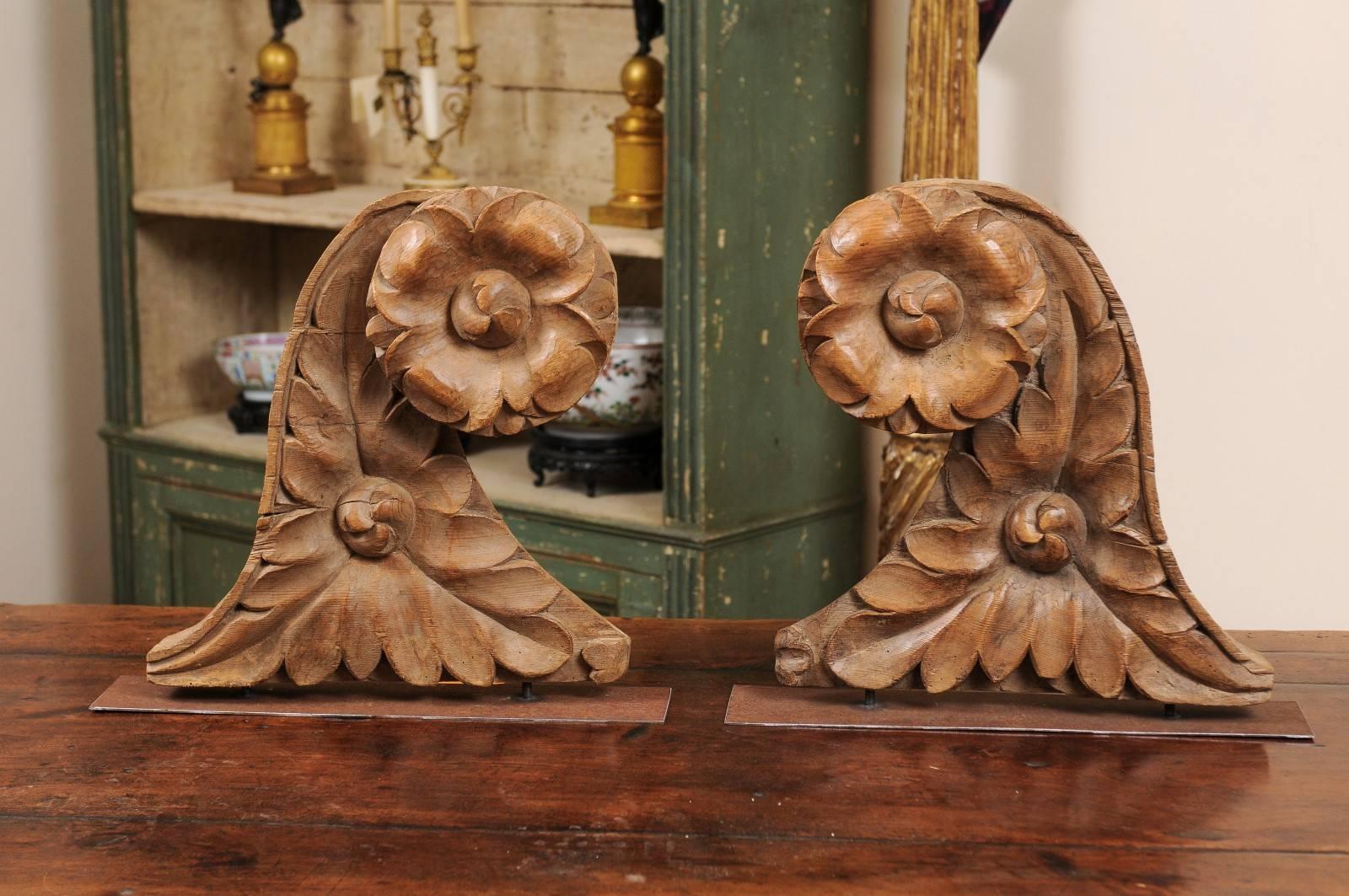 18th century French pair of architectural carved wood elements mounted on custom iron stands.