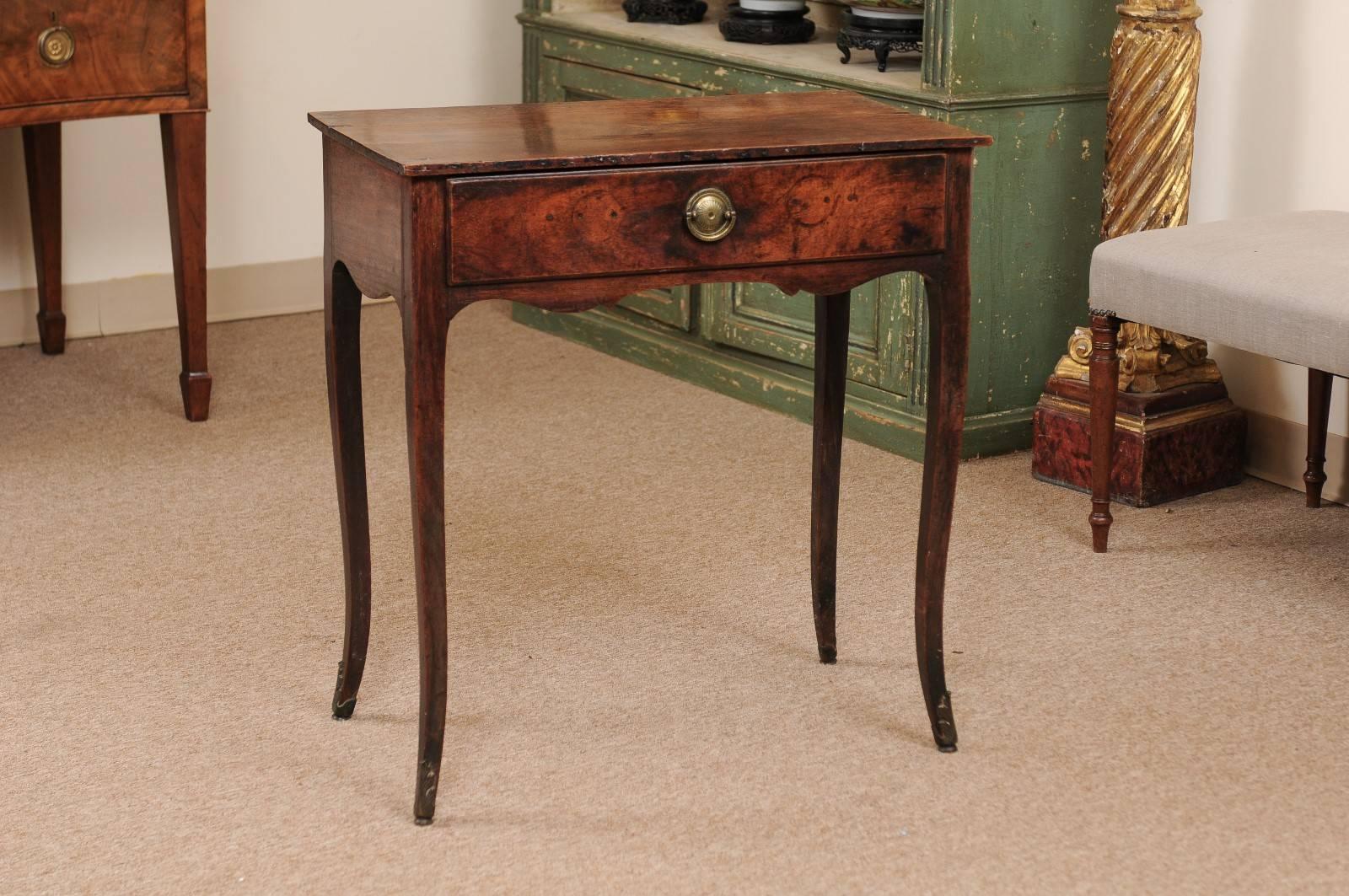 The Colonial Indian rosewood side table with rectangular top above drawer with brass pull, shaped apron and terminating in cabriole feet. Finished all on sides.