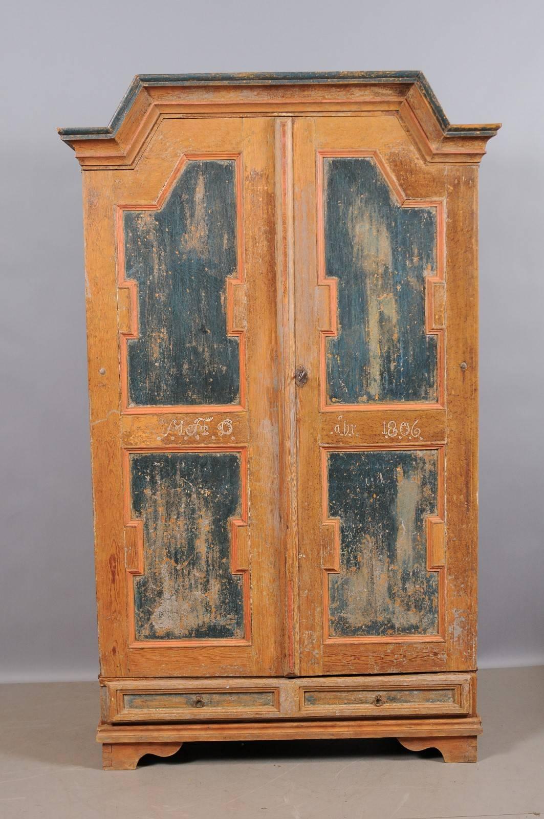 Swedish, early 19th century painted armoire in terracotta/rust and blue with lower drawer.



