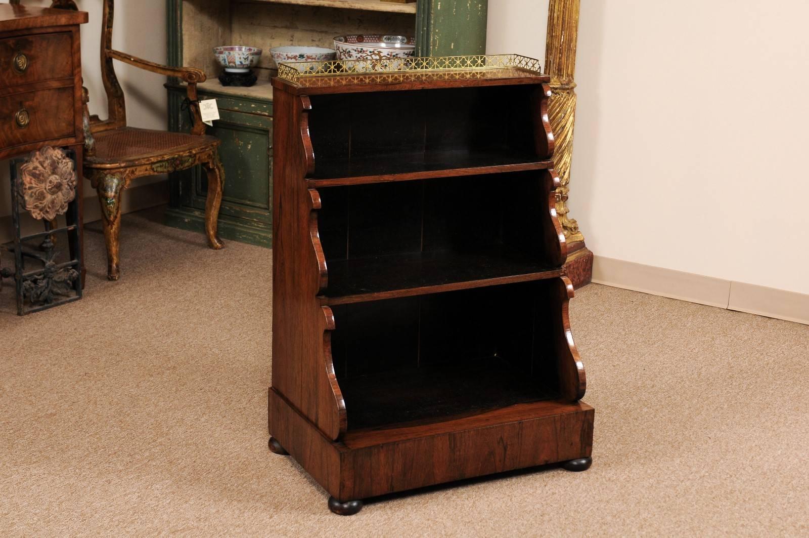Regency petite waterfall petite bookcase in rosewood with brass gallery and bun feet.

William Word fine antiques: Atlanta's source for antique interiors since 1956. 

 