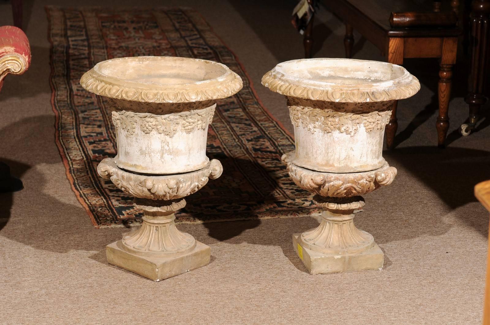 Large pair of cast stone Urn-Shaped Jardinieres / planters with Grapevine Motif, 19th century