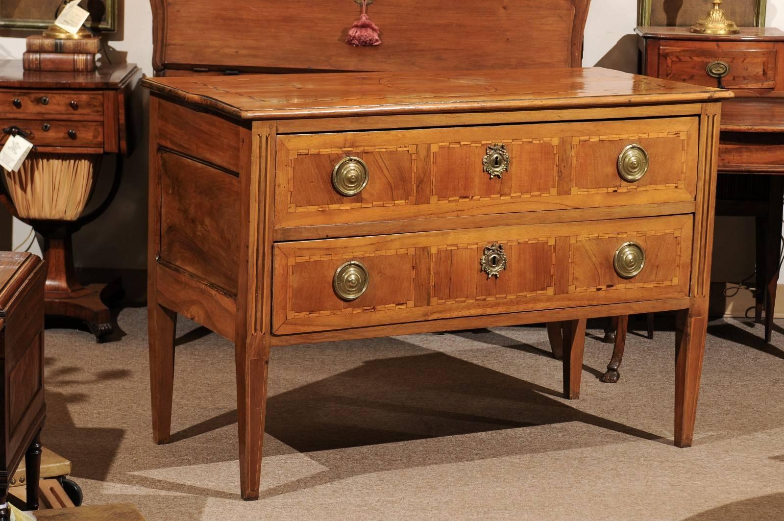 French Louis XVI two-drawer commode with and tapered legs. 

William Word Fine Antiques: Atlanta's source for antique interiors since 1956. 

 