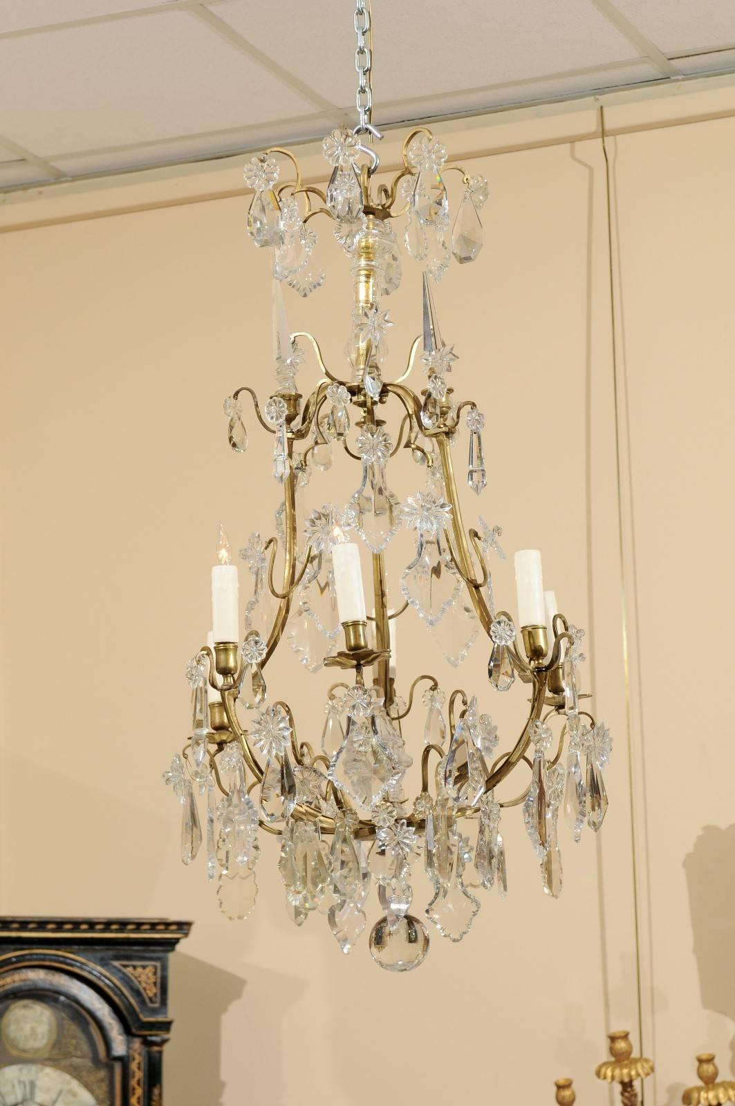 Late 19th century French Louis XV style chandelier with bronze frame and cut crystal pendants.