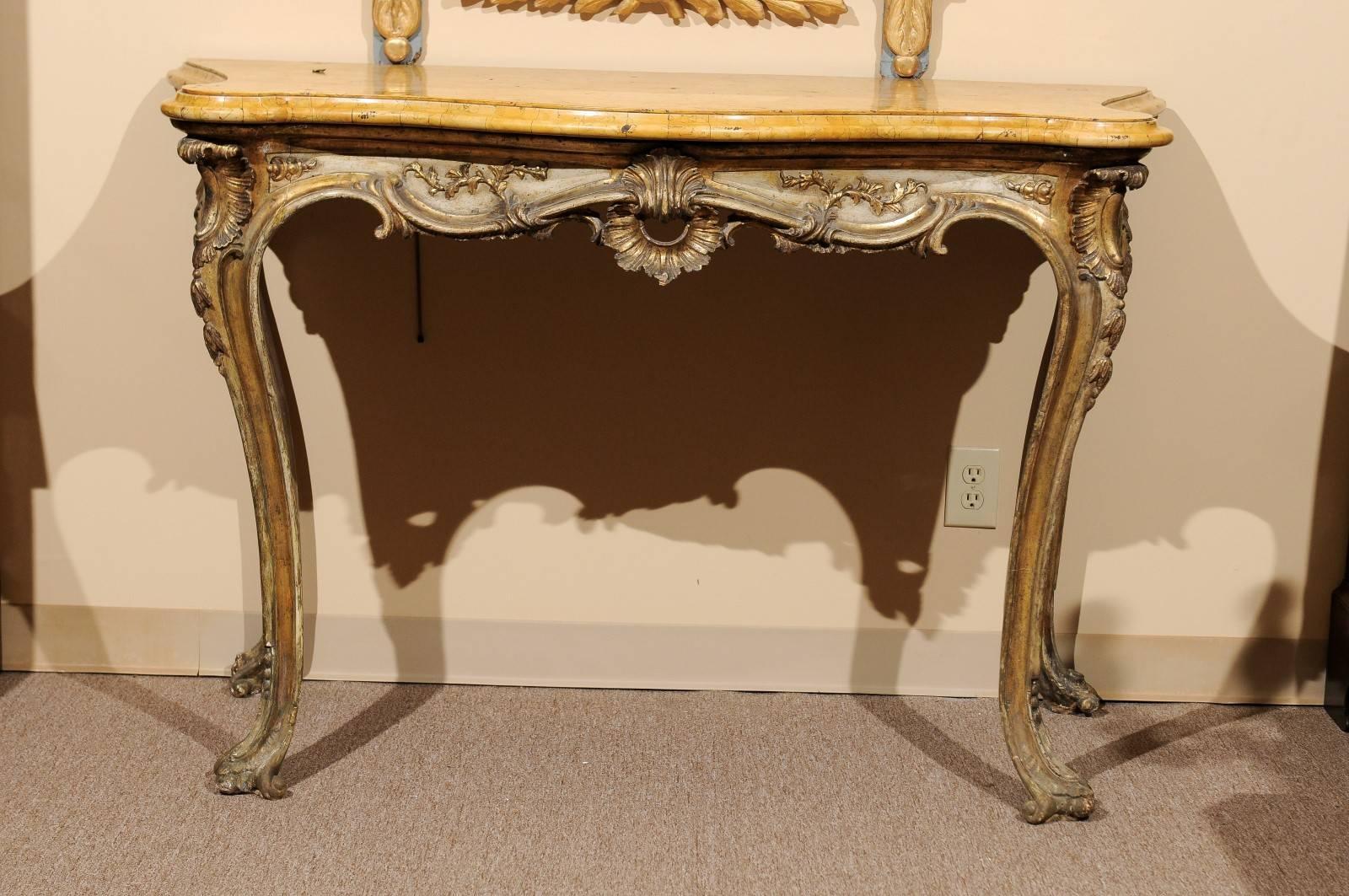 Large Italian silvered Rococo console with sienna marble top with serpentine form, carved frieze with pierced shell, acanthus leaf detail and cabriole legs. 

William Word fine Antiques: Atlanta's source for antique interiors since 1956. 

 