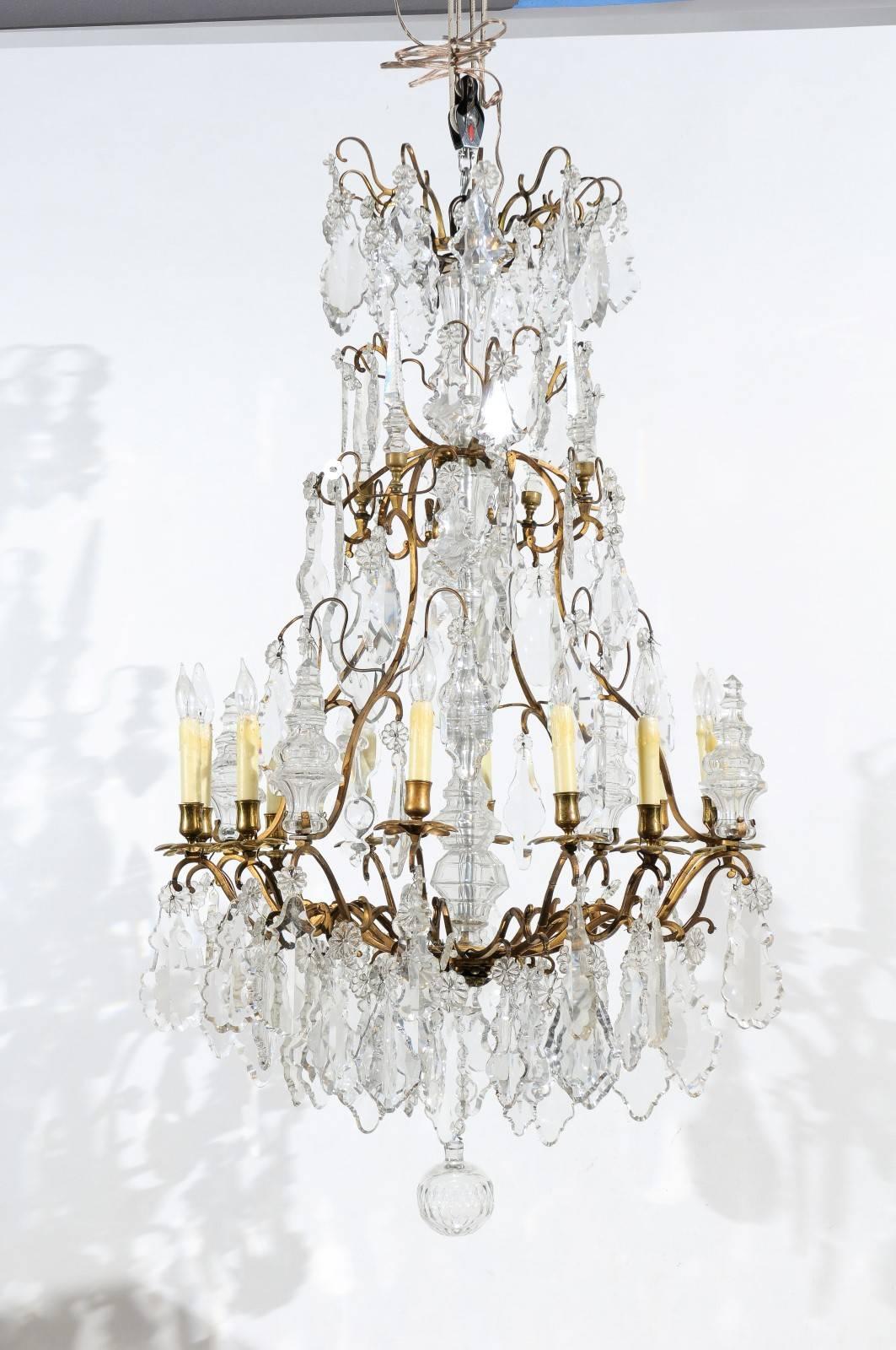 19th century Louis XV style bronze frame chandelier with crystal pendants and 12 lights.