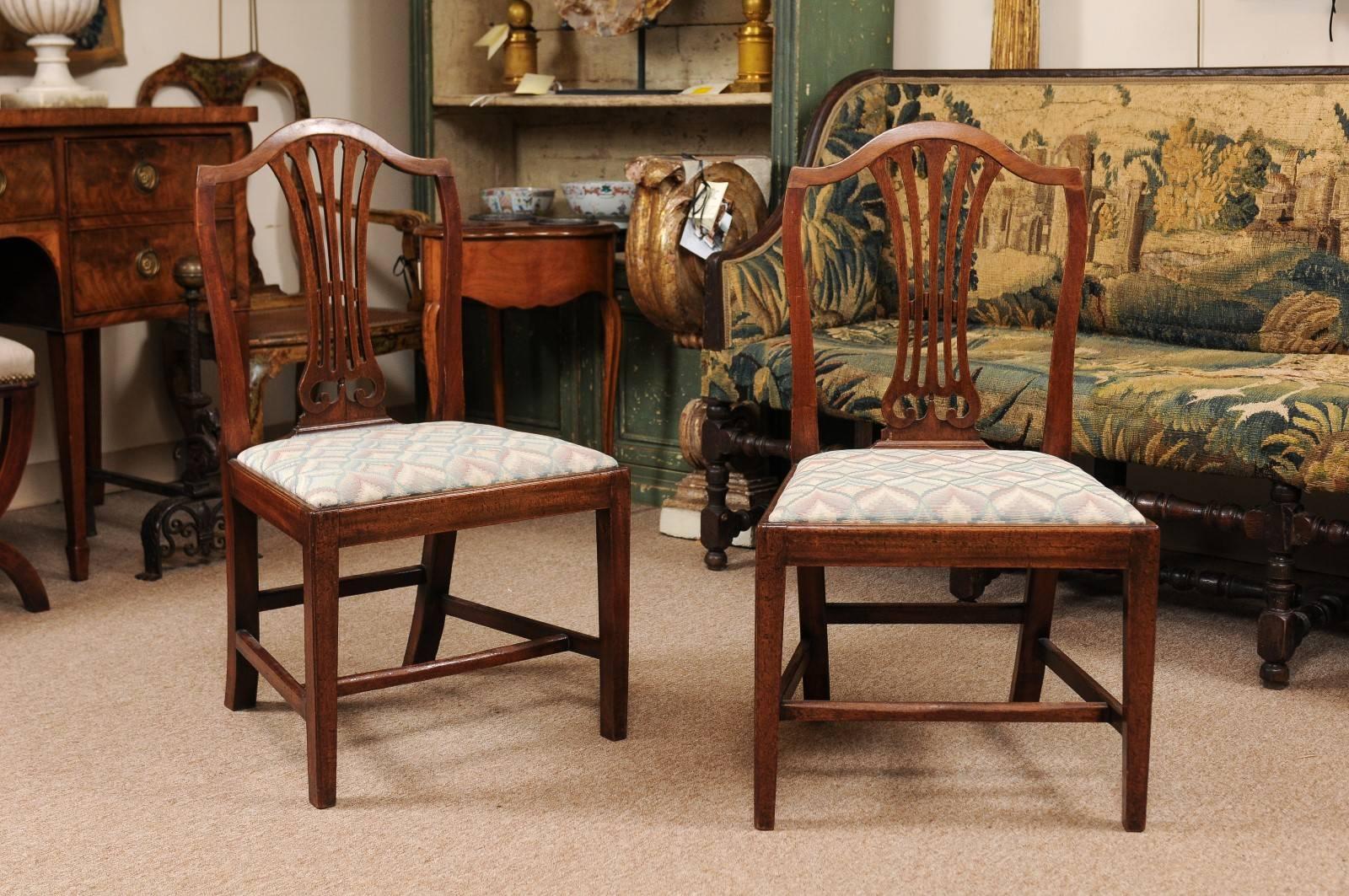 Set of eight George III dining chairs in mahogany with shield backs, slip seats and h-form stretchers.

William Word Fine Antiques: Atlanta's source for antique interiors since 1956.